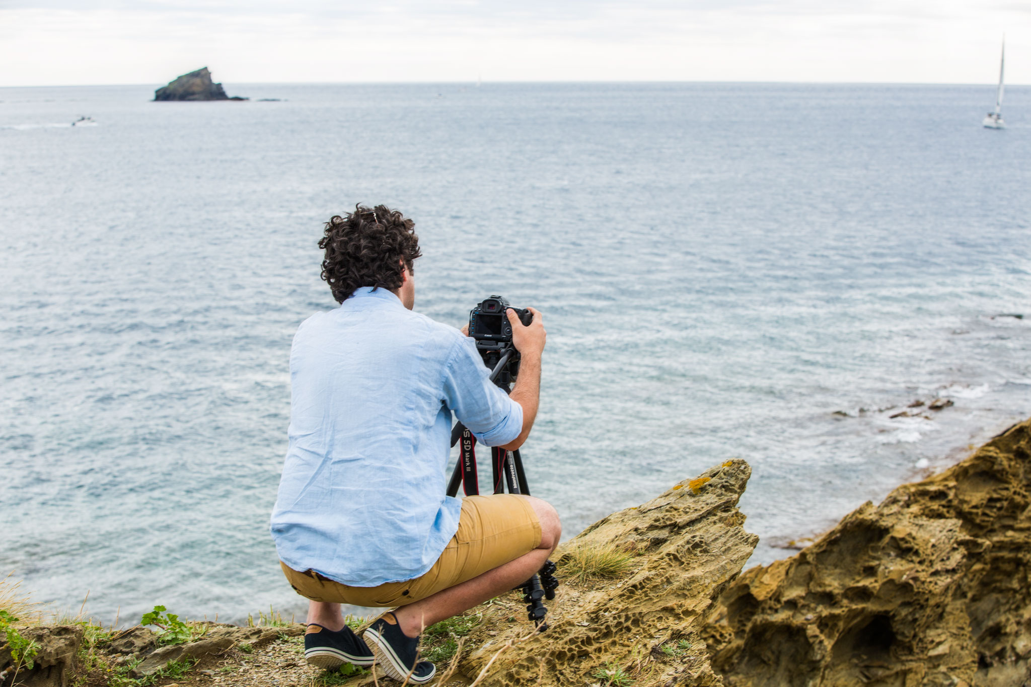 Arturo photographing the rock that Salvador Dalí would become obsessed with and include in many of his paintings.