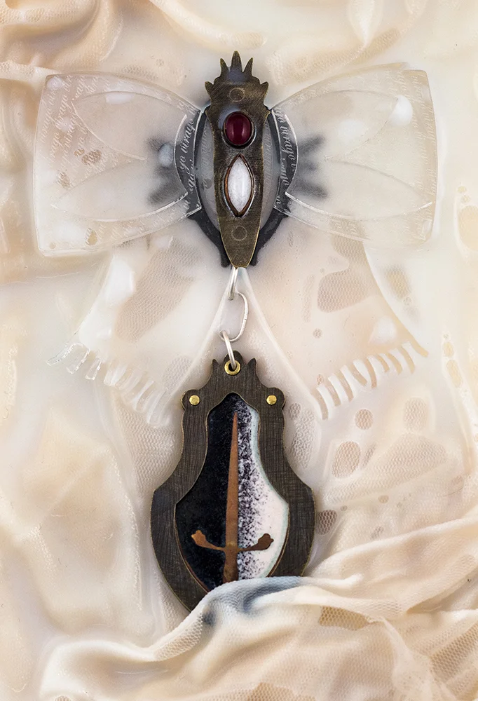 The Archaic Order of Virago (Brooch), Materials: Brass, copper, silver, CNC laser cut acrylic, vitreous enamel, & piano wire. 2017. Photograph courtesy: ECR