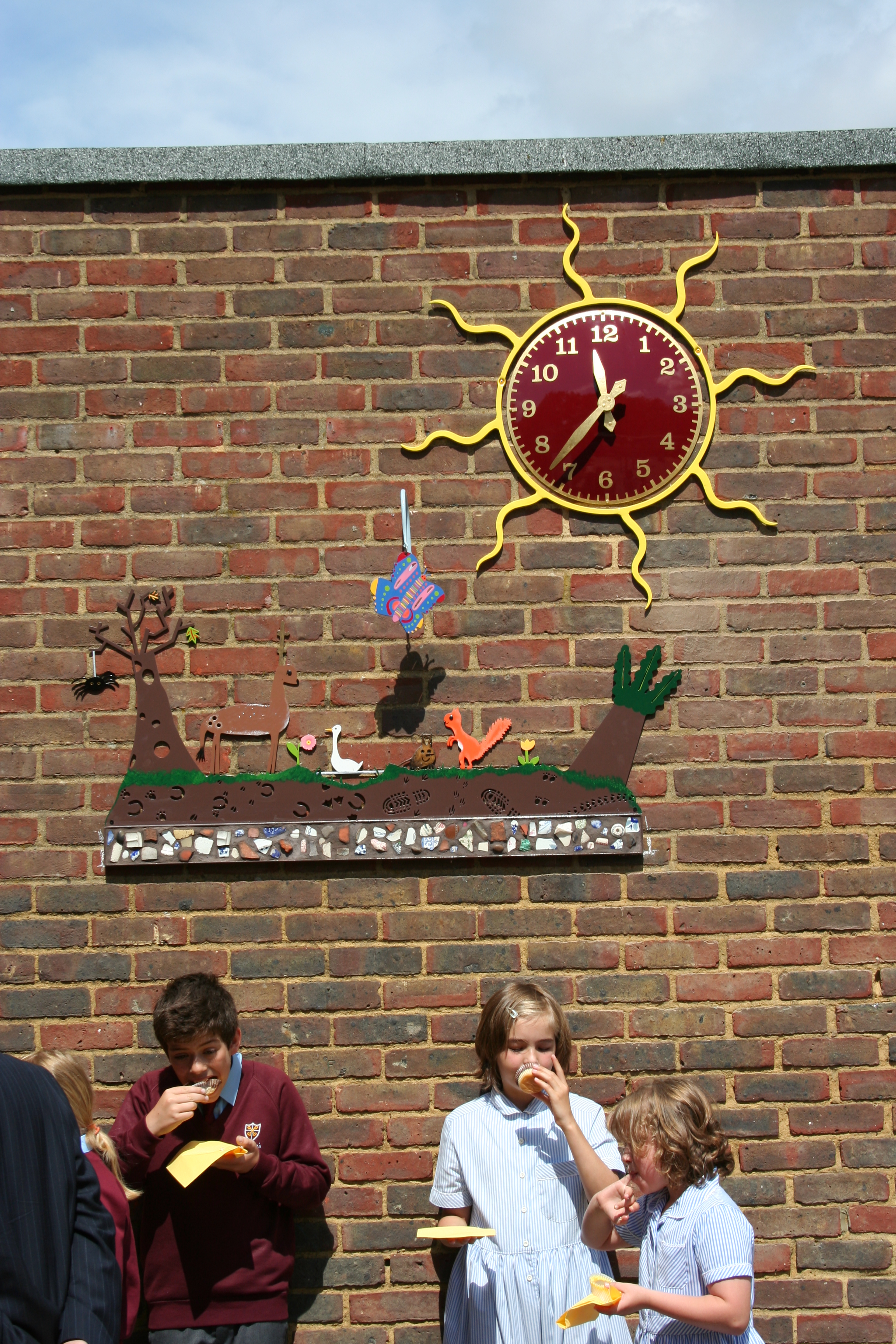 Clock and wall panel for a primary school
