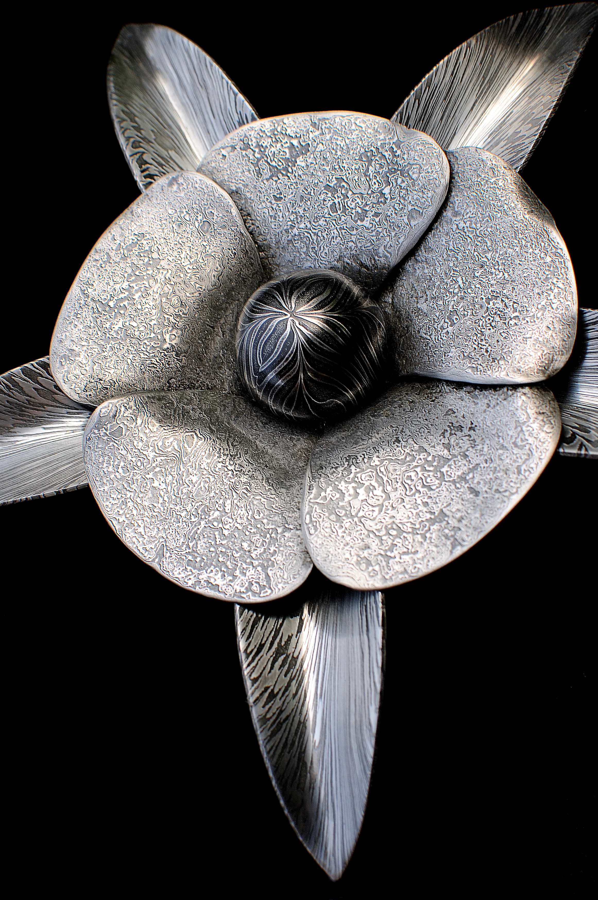 Pattern-welded Flower by Mick Maxen - AVAILABLE (set on driftwood with smaller flowers) - £2400. (This piece won the Reserve Show Champion at the Dorset Show).