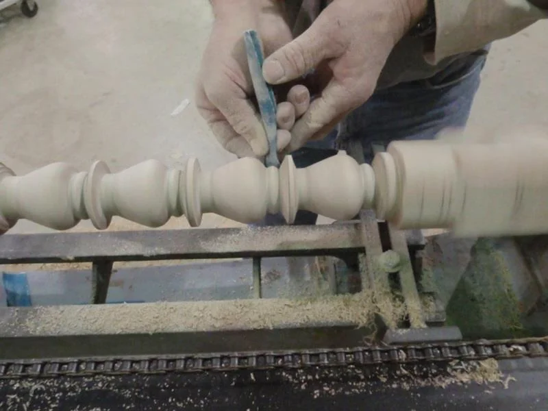 Carl turning parts for a job.
