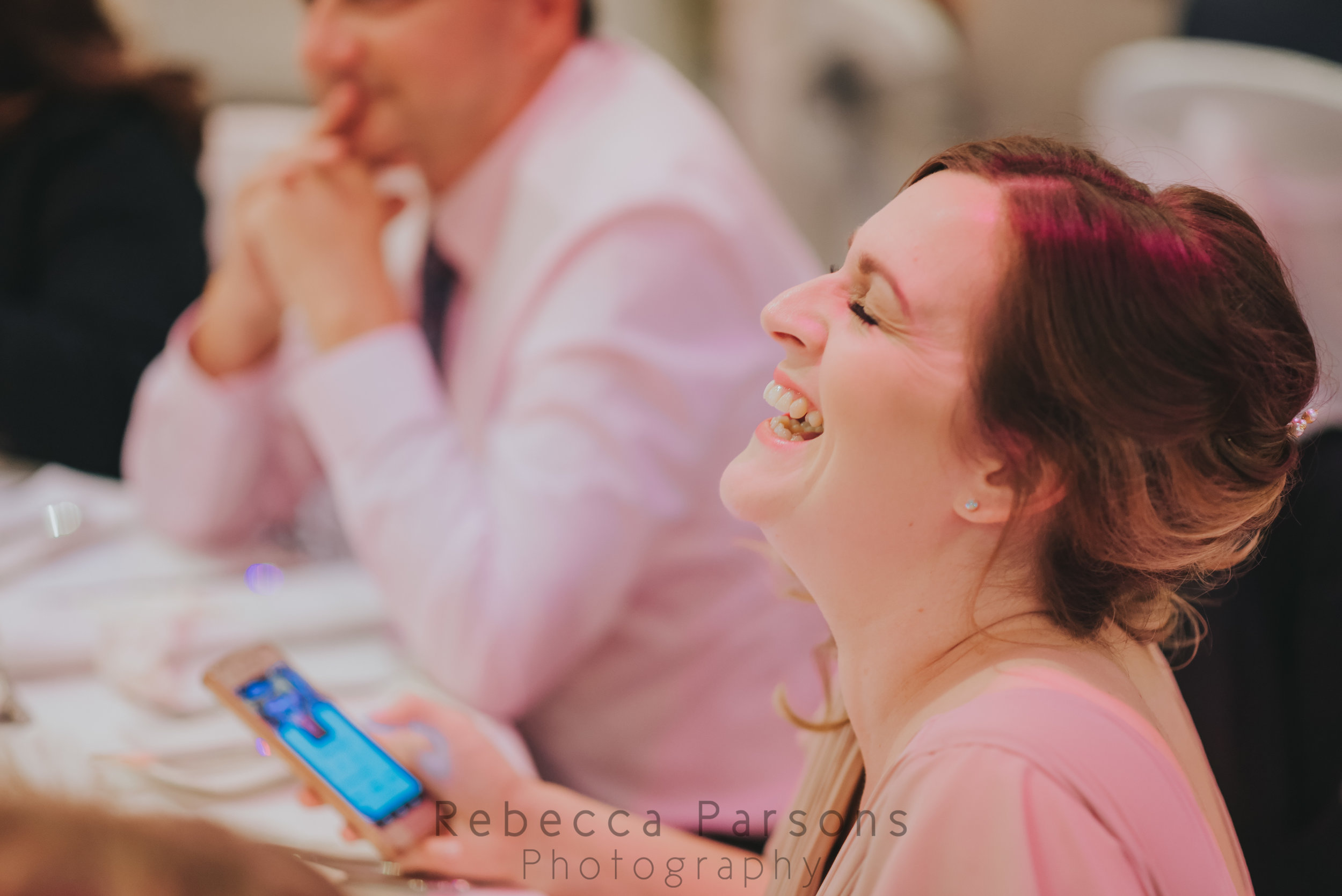 Bridesmaid laughing in speeches