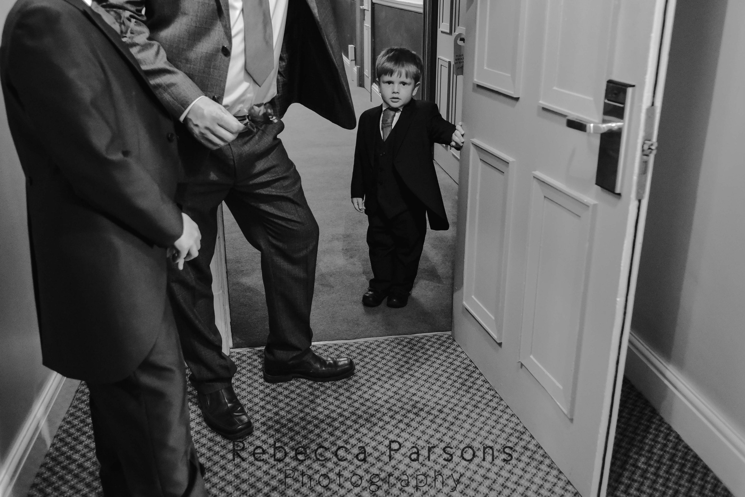 young-usher-standing-by-door