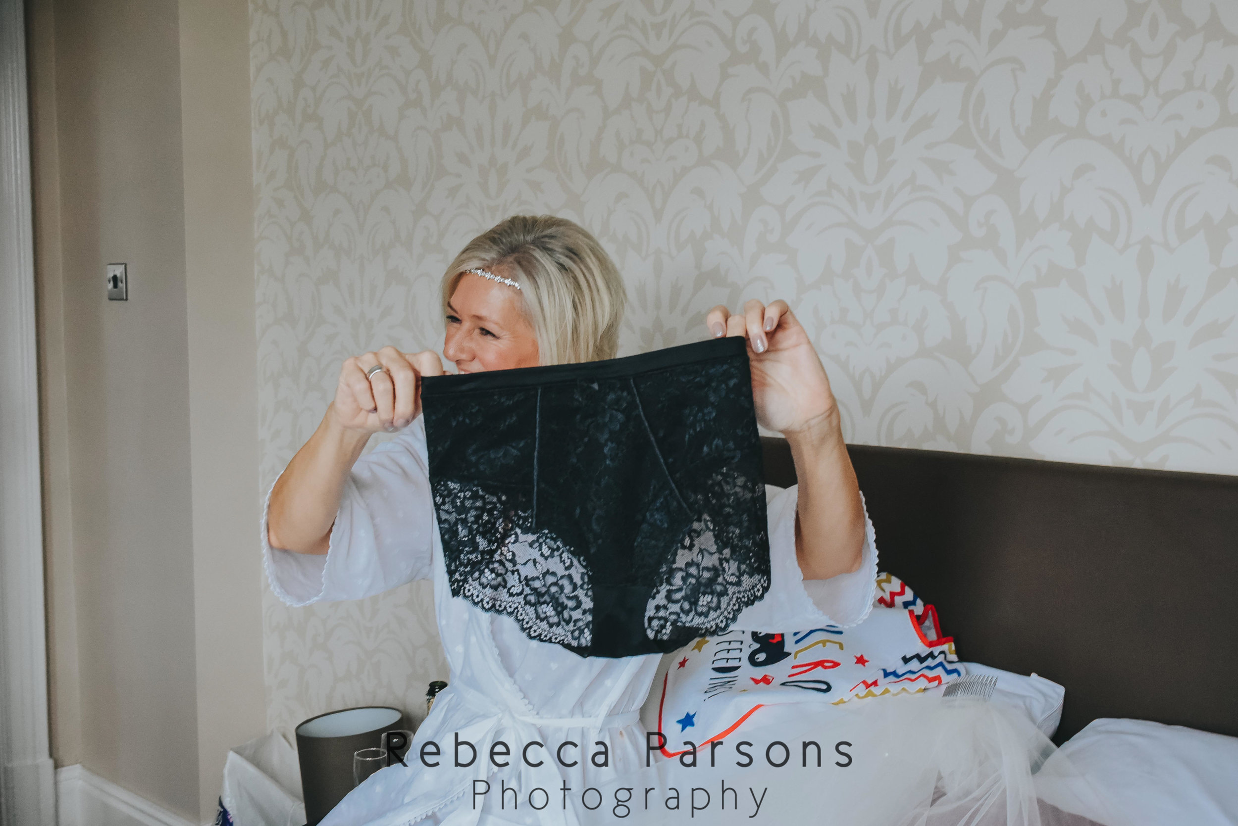 mother of the bride holding up big knickers