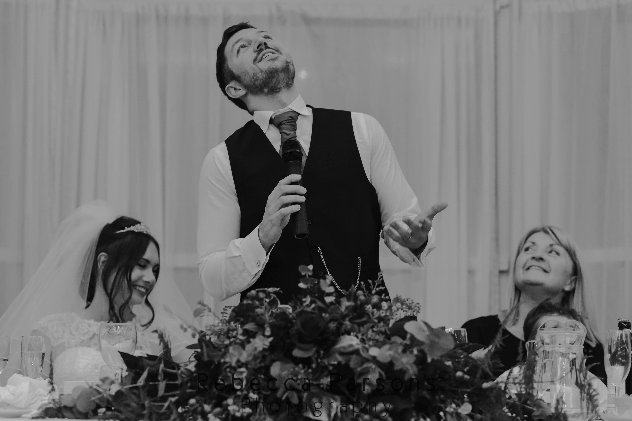 groom giving speech black and white