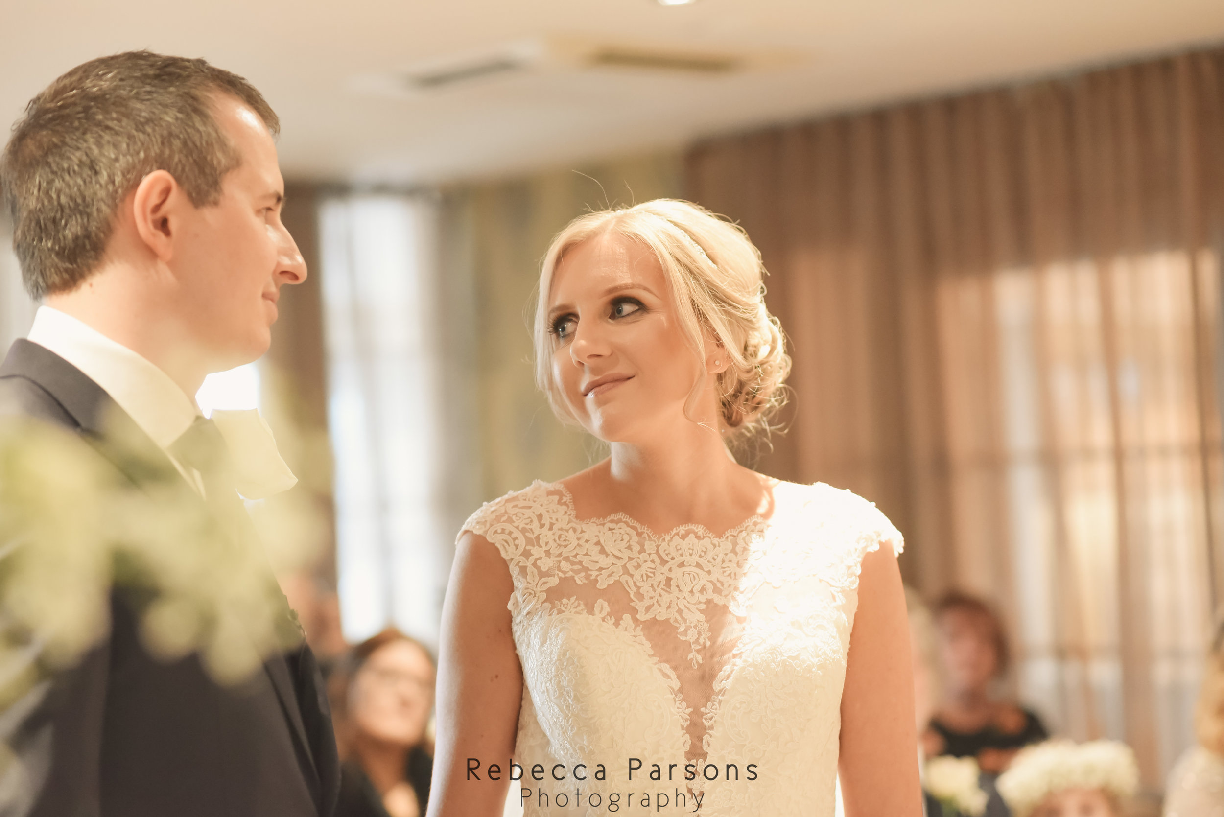 bride and groom looking at each other