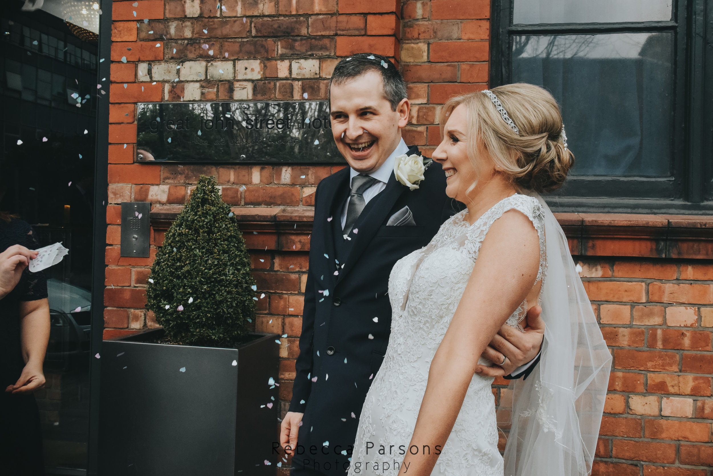 confetti being thrown over newlyweds