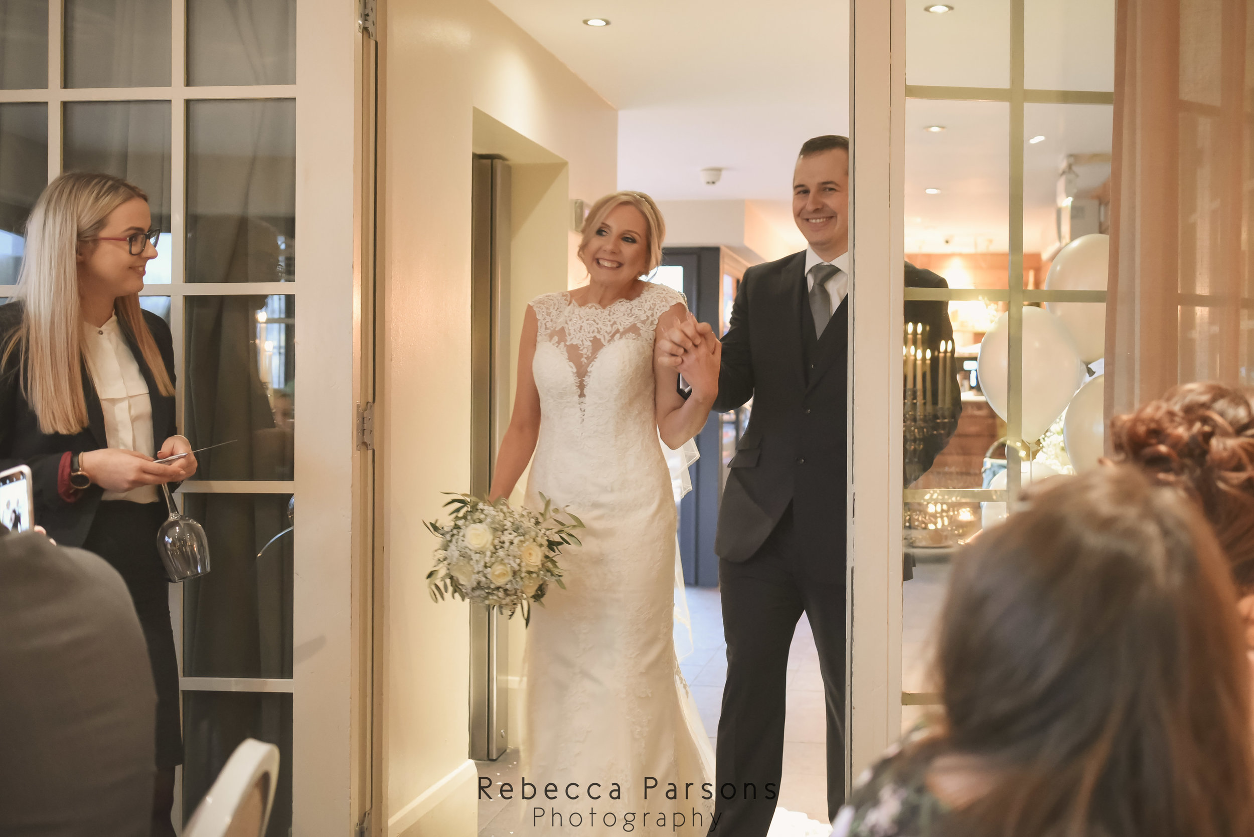 bride and groom walking into breakfast