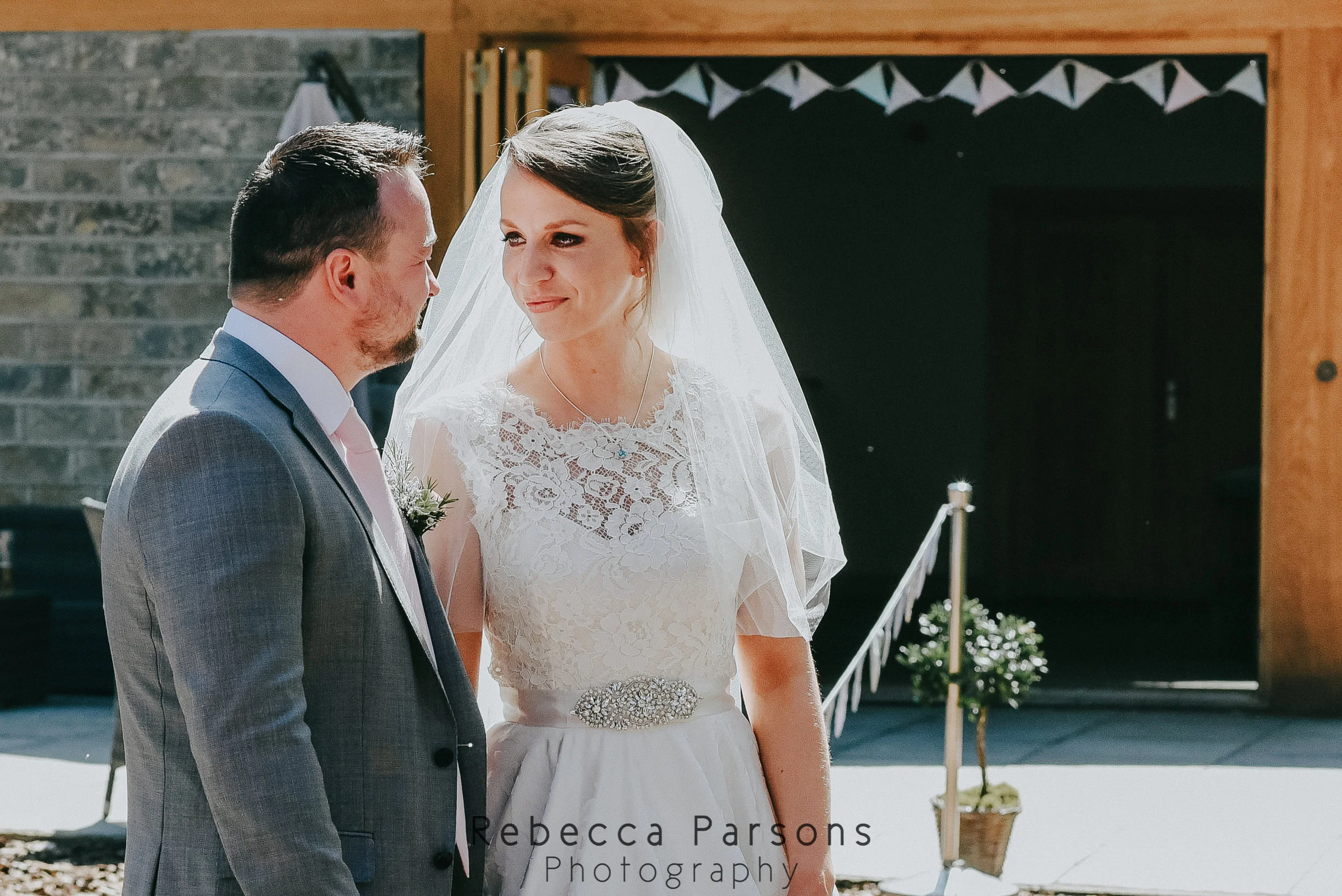 bride and groom looking at each other
