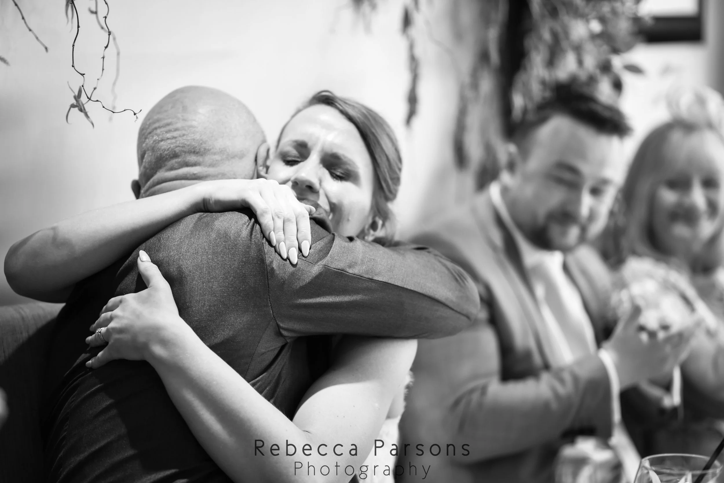 bride hugging dad black and white