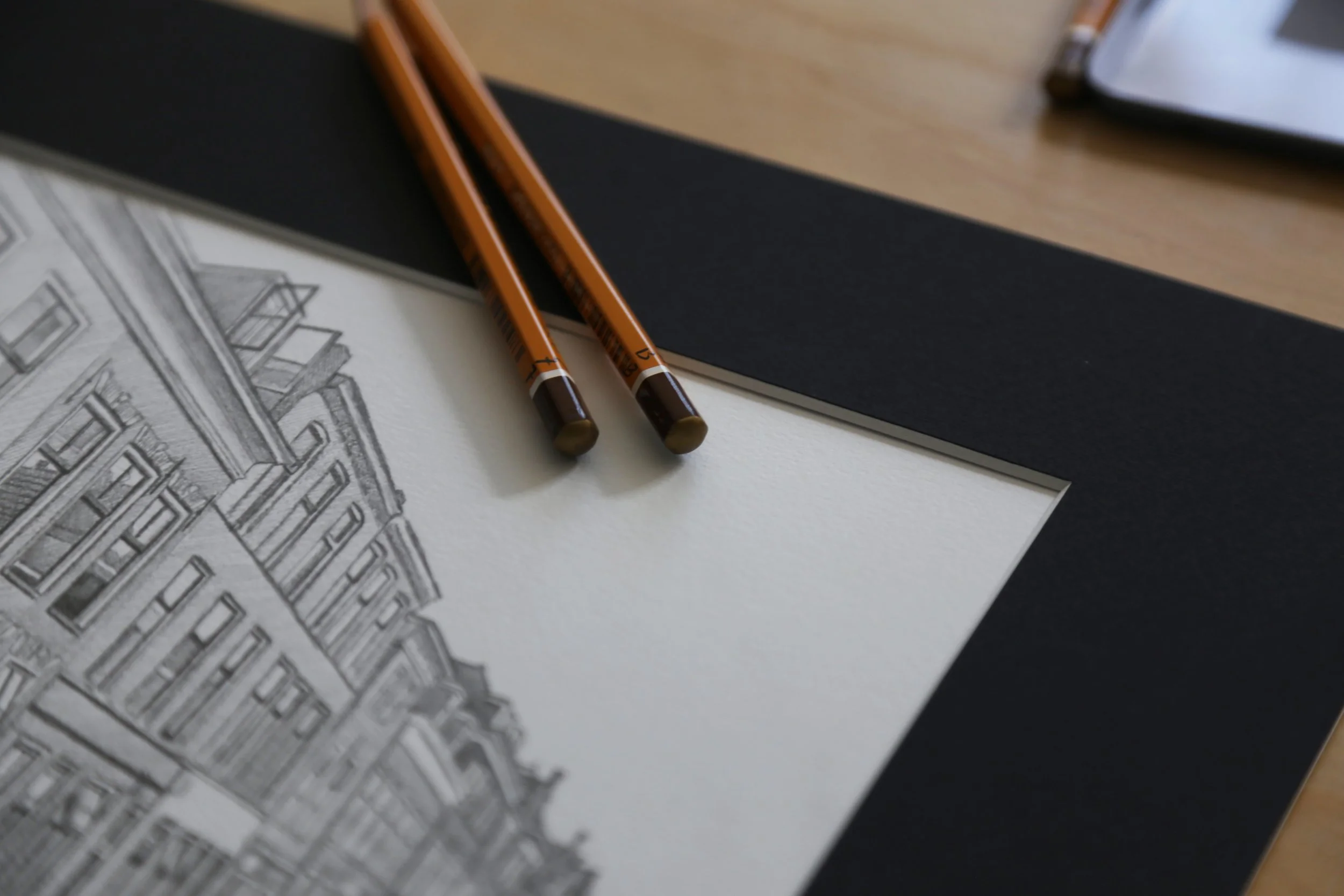 Tekening van huis met zwart passe-partout