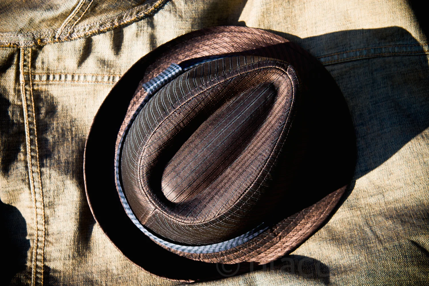 hat on denim