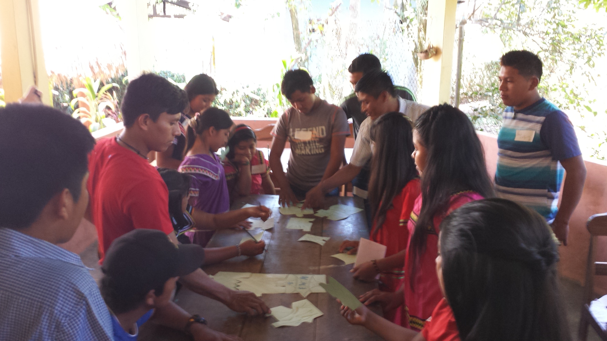 9. Students completing a puzzle with each of their names on one piece. Our students come from multiple communities and attend many different schools; some have known each other for years, and some have never met or only see each other once a year at the entrega. It’s always great to see our students working together and getting to know each other during the entrega ceremony.