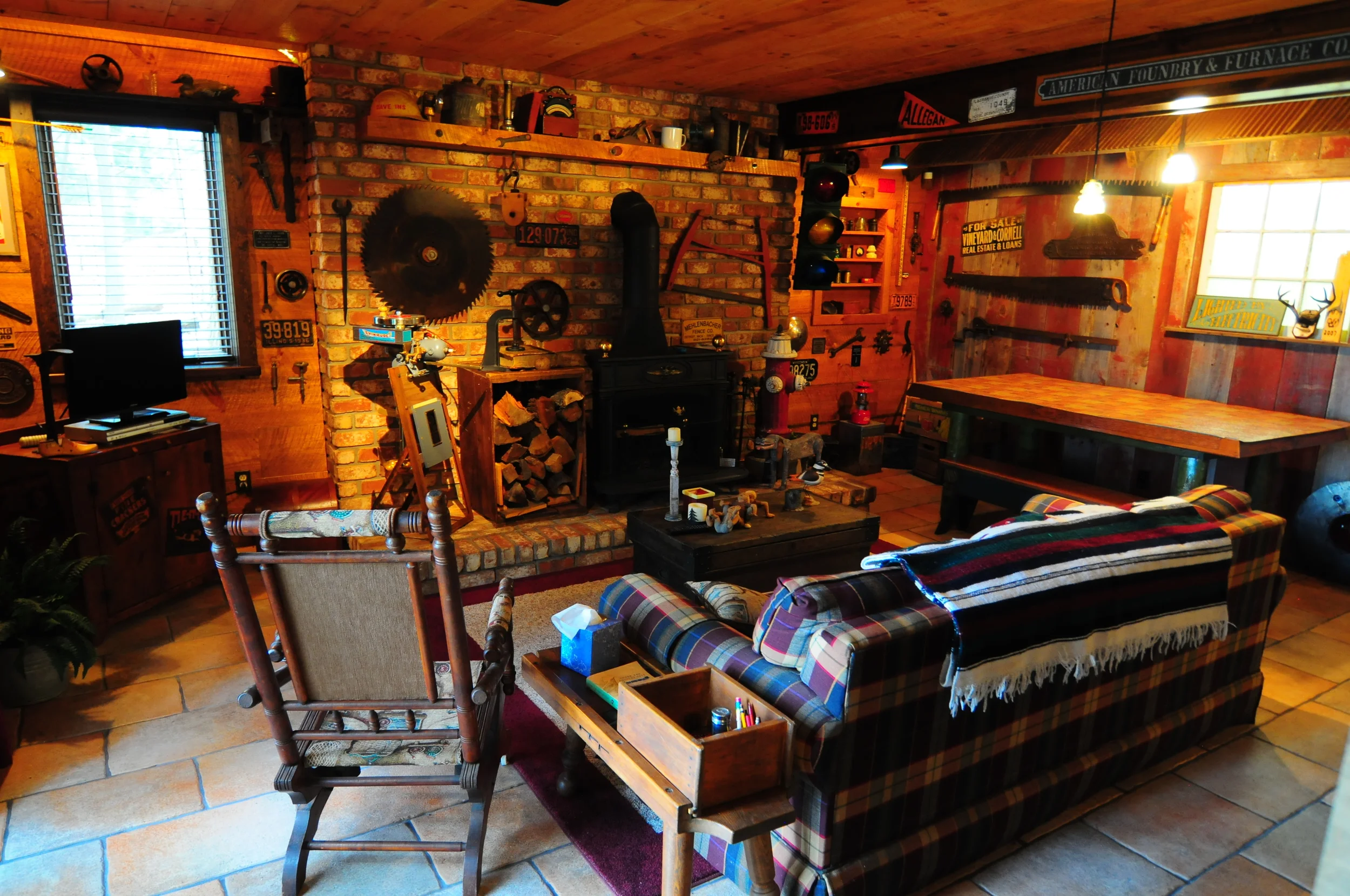 Sitting room with TV, fireplace, and mini-fridge and bar sink.