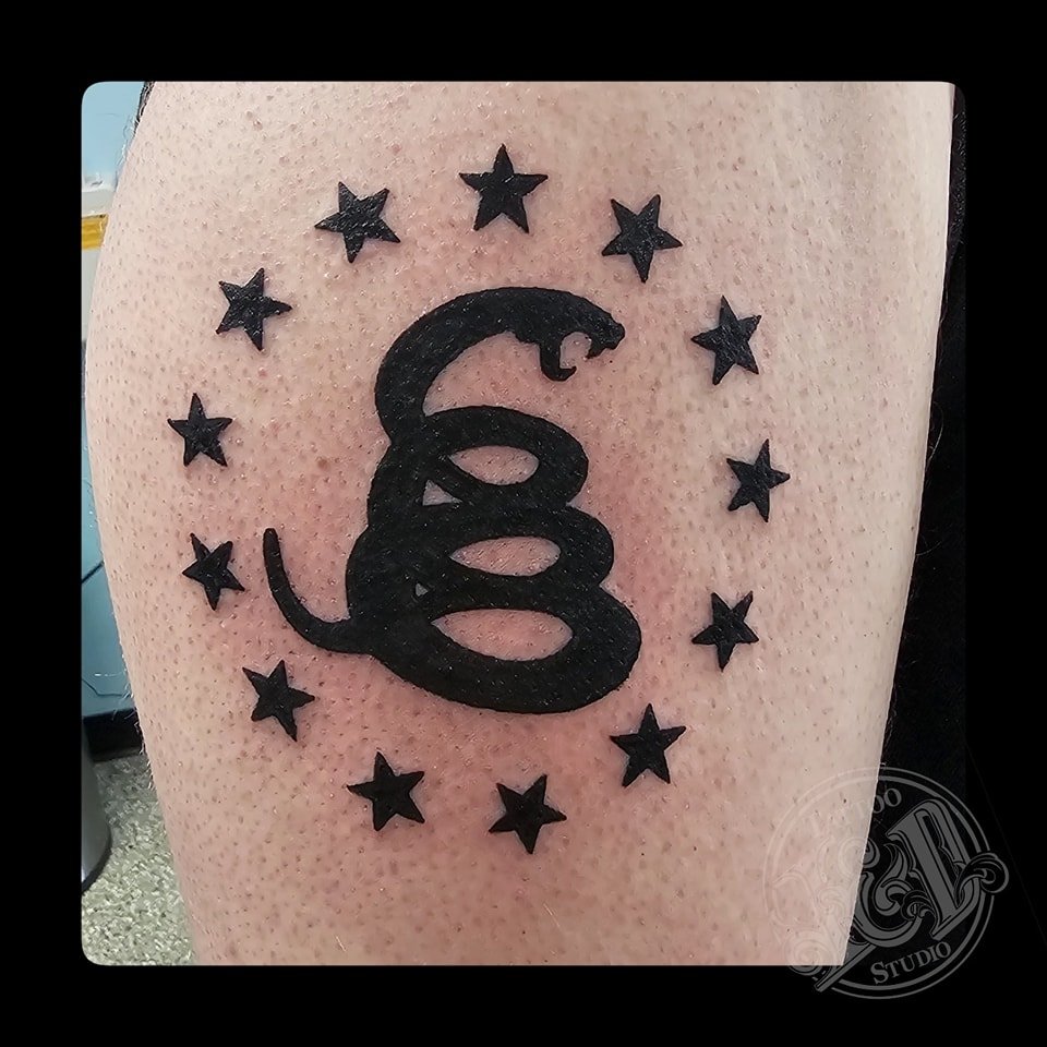 Rock solid black snake and stars by Andrew Schaub (@fortressofdreams) stop in and see him today! #snake #stars #blackwork #solidblack #donttread #nosteponsnek #inkanddestroy #inkanddestroy