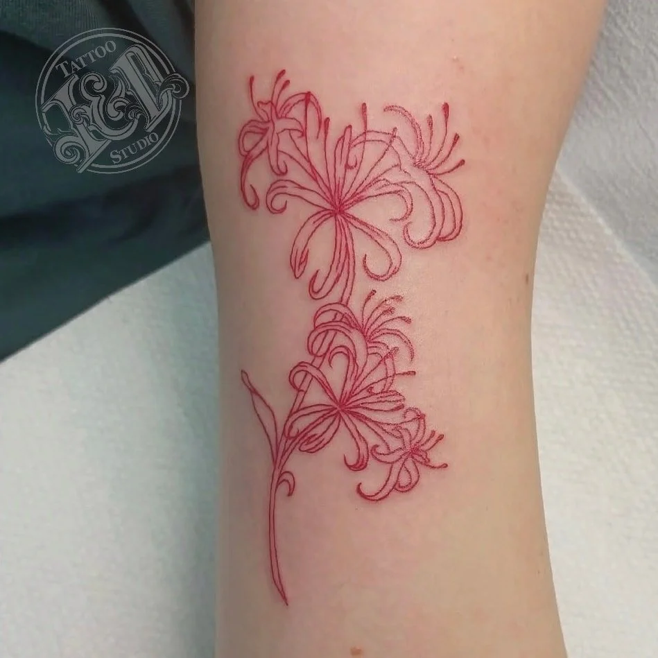 Beautiful spider lily cluster by @stabinks she has openings available, so stop in and see her for a cool tattoo! #flower #bloom #blossom #spiderlily #flowertattoo #redtattoo #inkanddestroy #tattoo