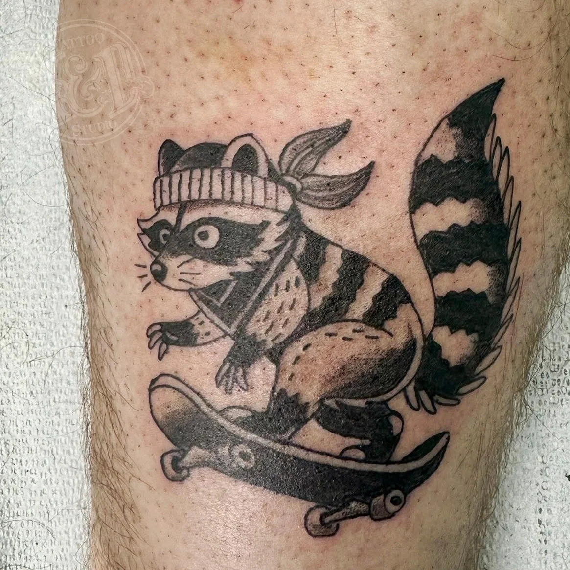 Little skateboard bandit by @jessicawilhelm stop in and see her for a tattoo that shreds! #raccoon #animal #trashpanda #skateboarding #shredding #inkanddestroy #tattoo #blackandgray