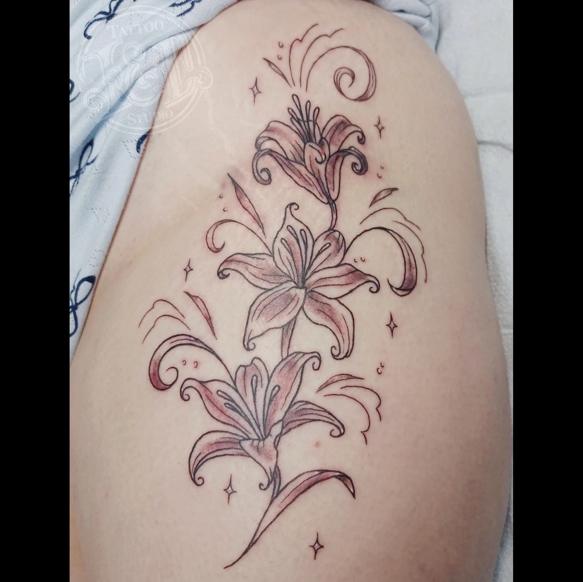 Some lilies by @stabinks stop in for all the spring vibes and see what blossoms! #lily #lilies #flower #flowers #blossoms #blooms #flowertattoo #inkanddestroy #tattoo #blackandgray