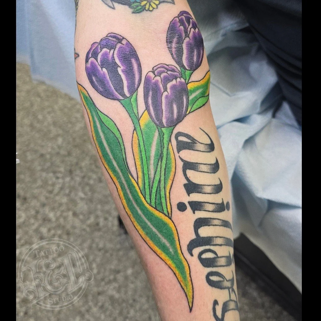 Some tulips by @danwatkins.tattoos flowers only stay for so long, so why not get a flowery tattoo you can enjoy all year round! #flowers #blooms #blossoms #flowertattoo #tulips #inkanddestroy #tattoo