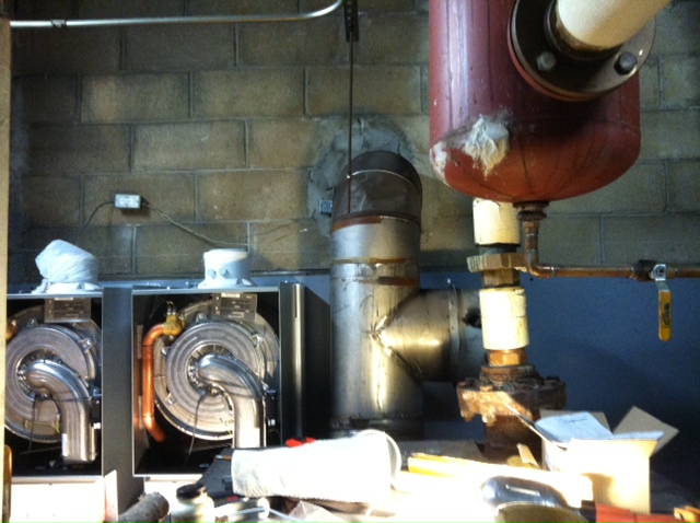 During installation: Working behind the existing boiler