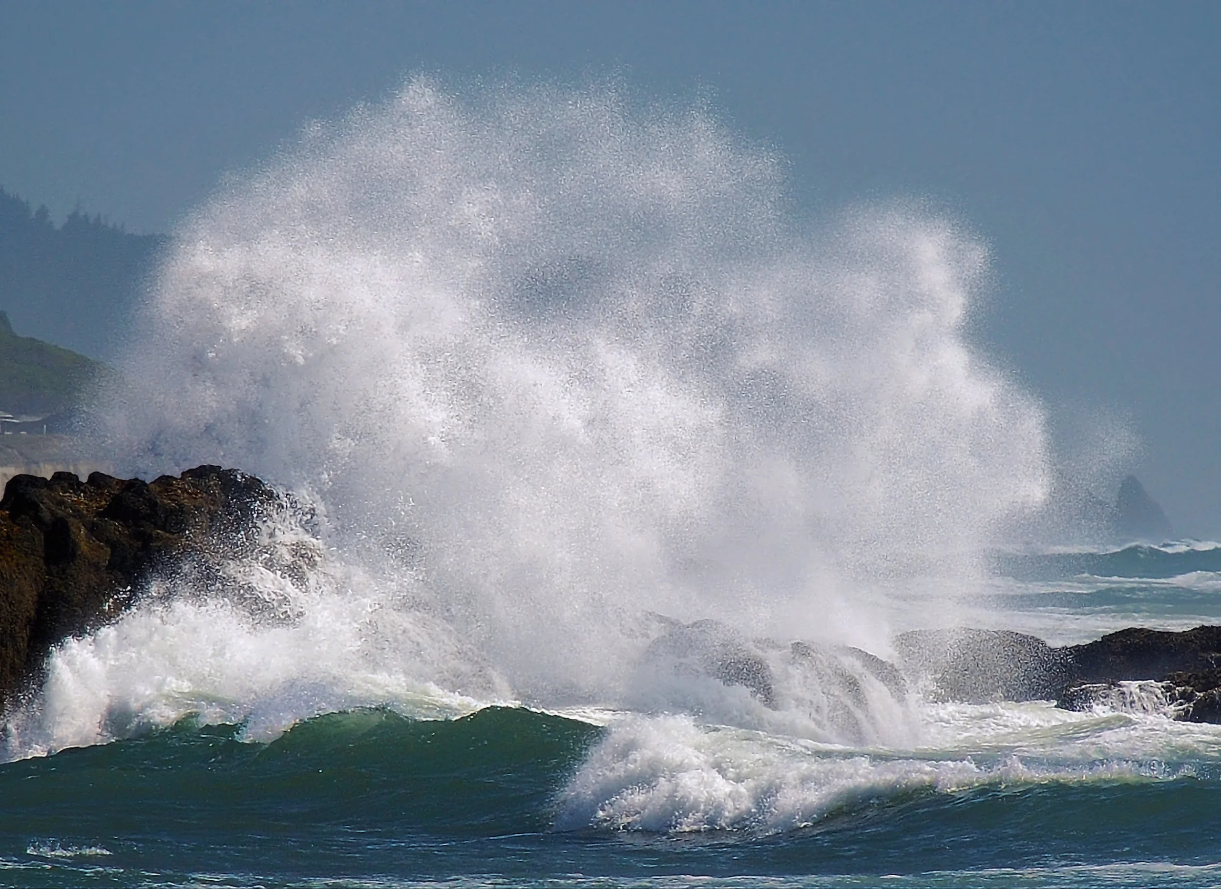 Splash Oregon Coast. A wave splashes against the rocks along the middle part of the Oregon Coast. Purchase options