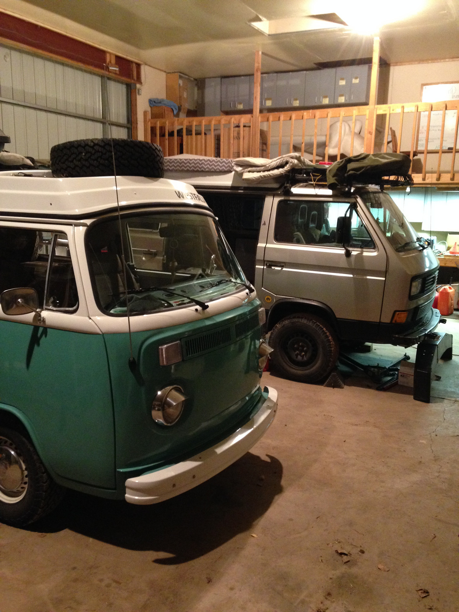 The bus getting an oil change while Mark installed the Subaru in their van, Tortuga Plata.