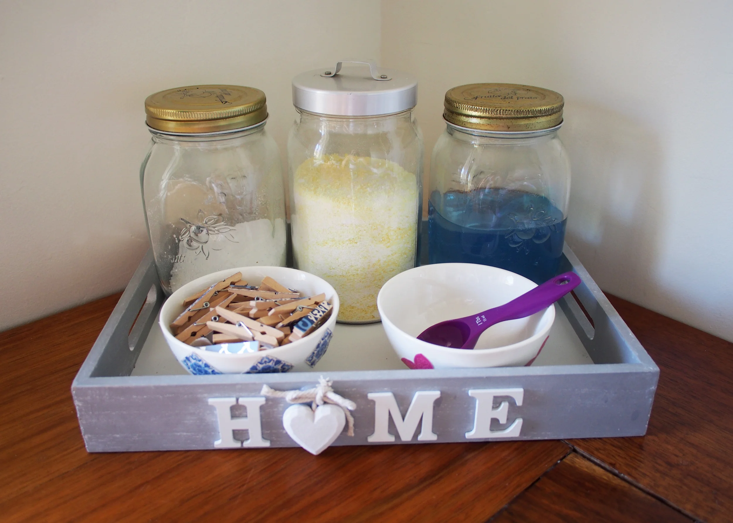 using a tray to organise laundry supplies