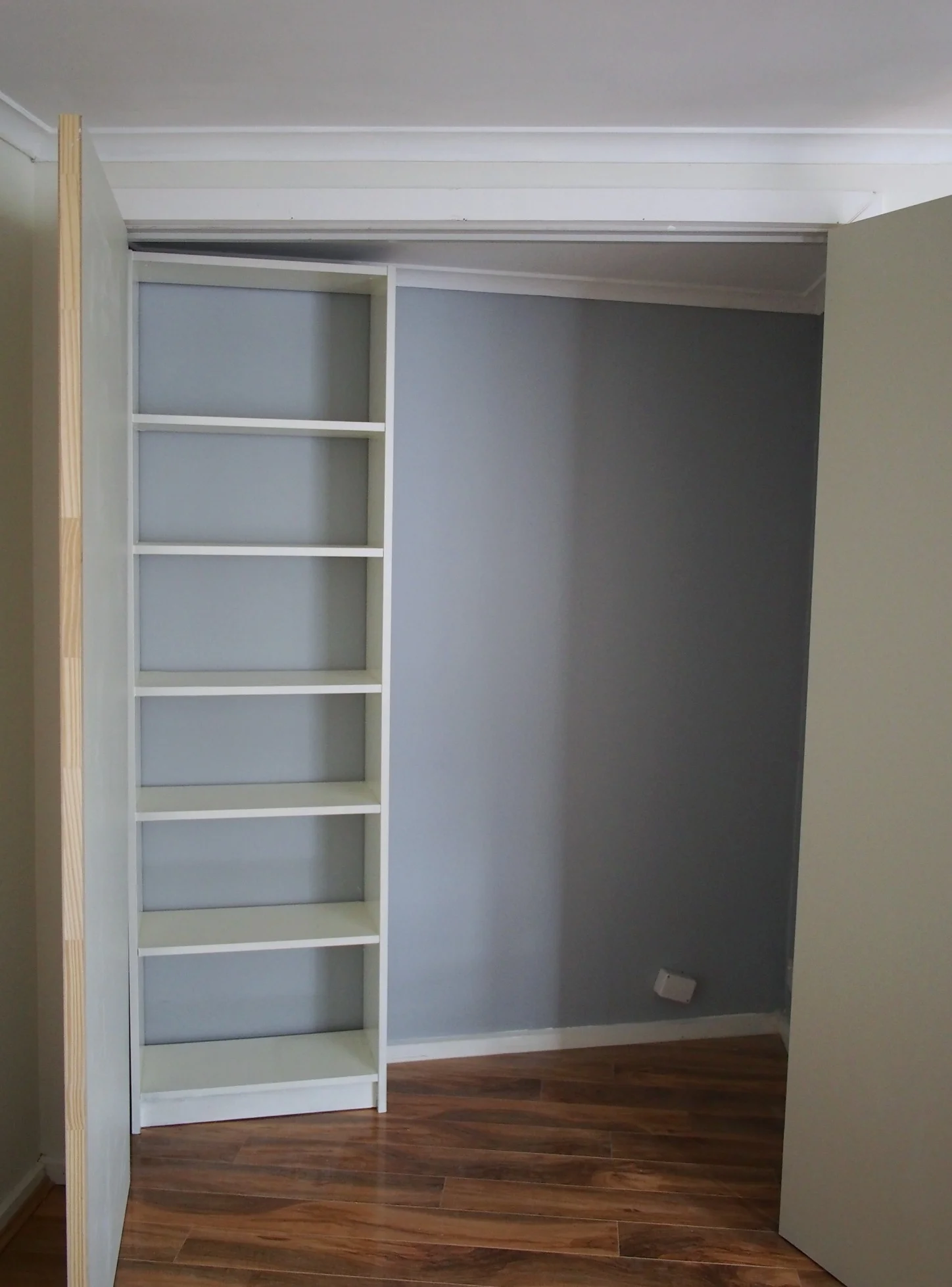 Billy bookcase in storage cupboard