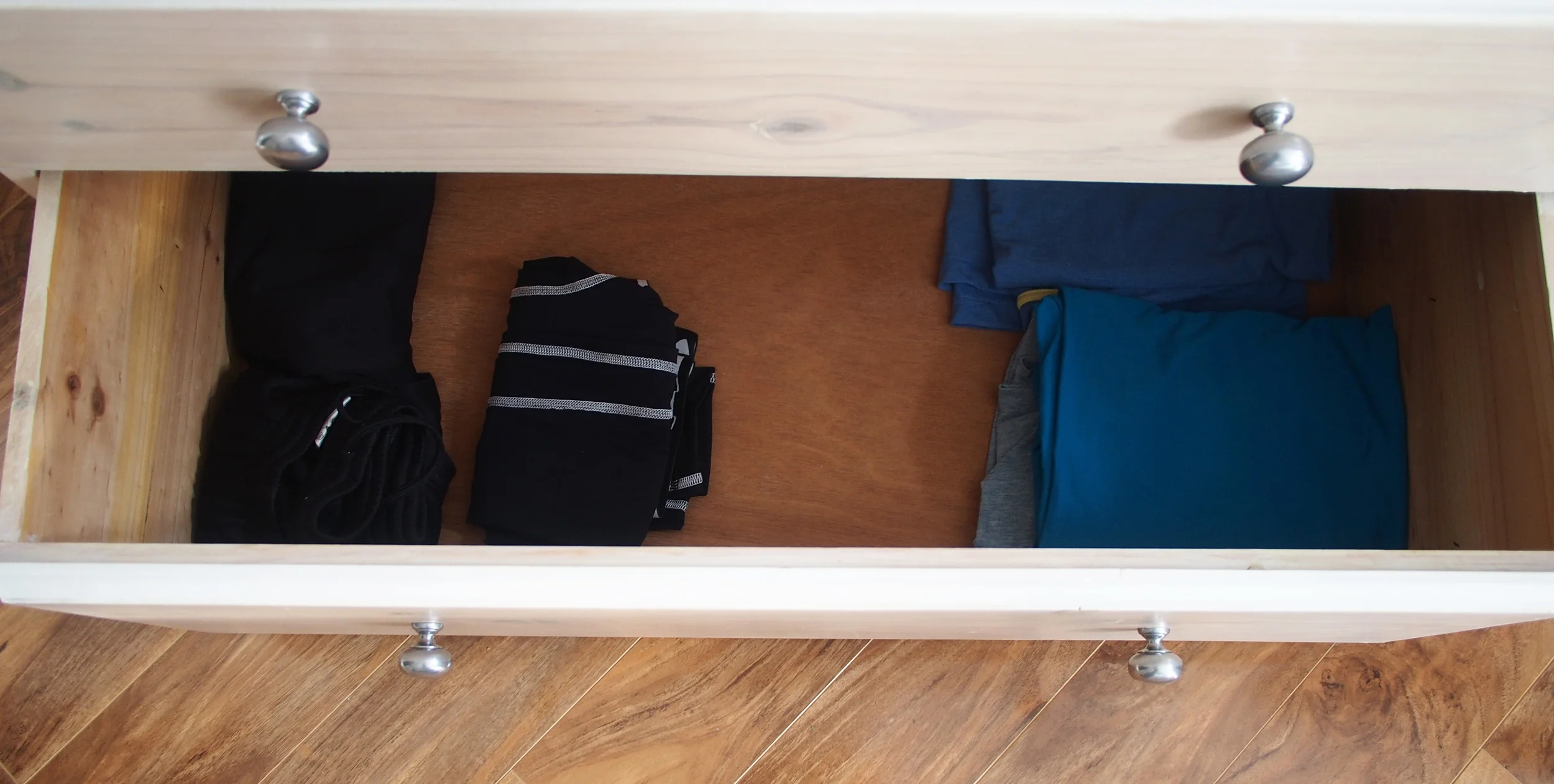 organising clothes in chest of drawers