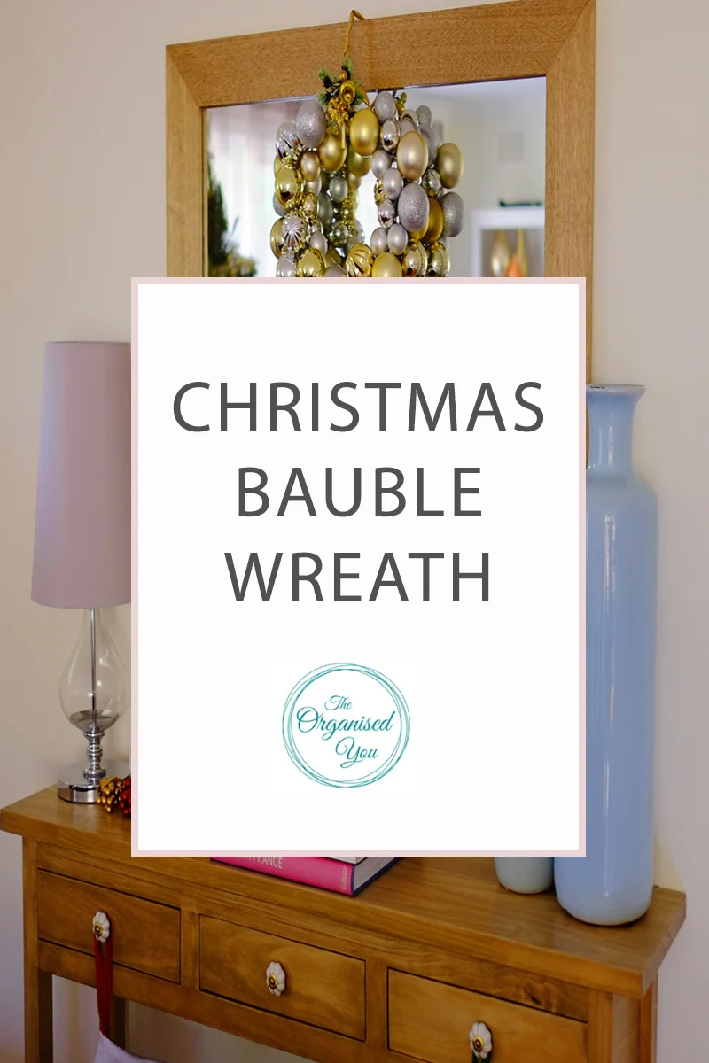 DIY Christmas Bauble Wreath - do you like to get creative at Christmas time and make decorations for your home? I show you how to make a fun and easy bauble wreath, which is inexpensive and really adds to your Christmas decor. Click through to read the full tutorial.