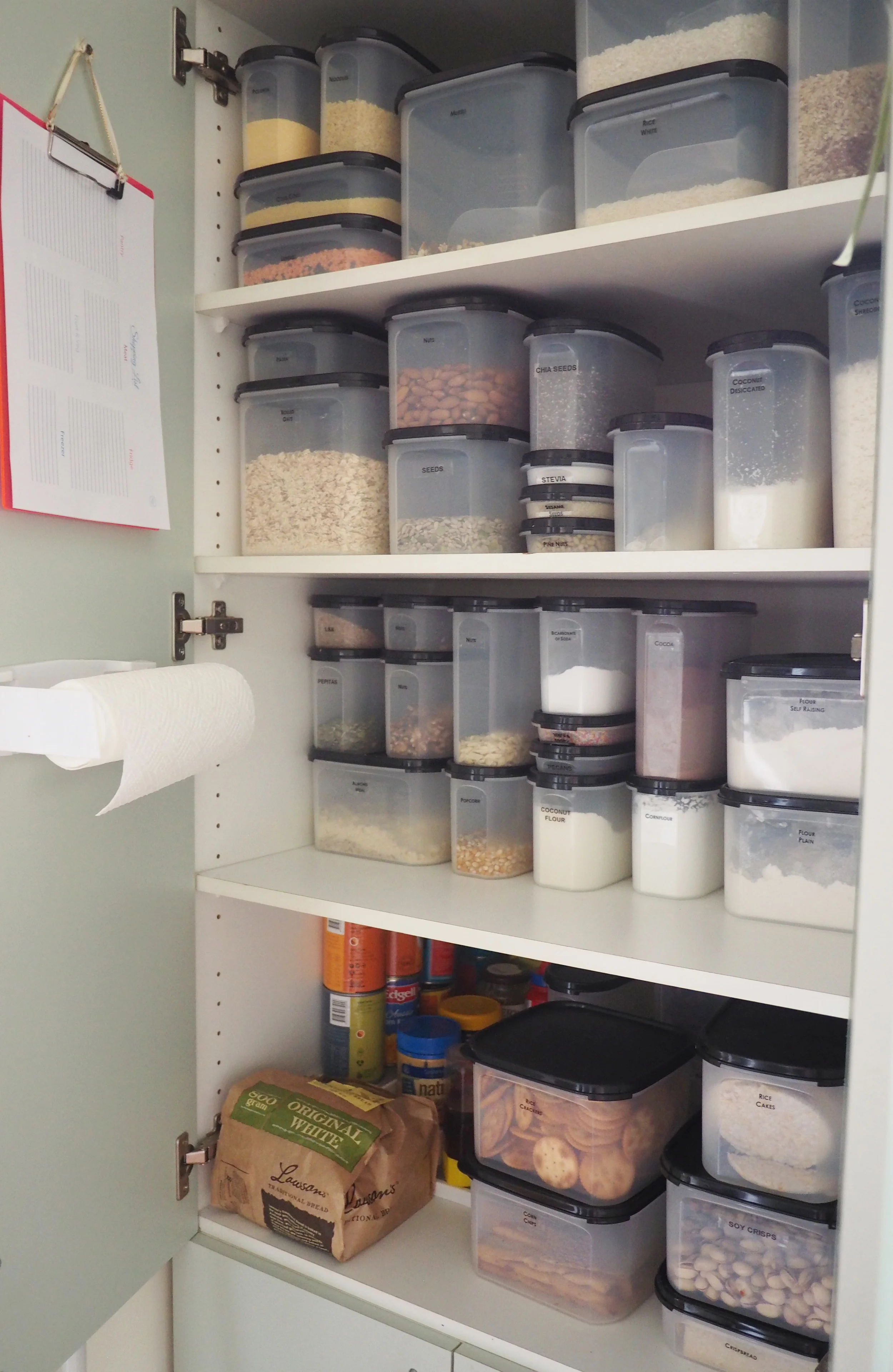 An organised pantry using air-tight containers to store food items according to type and create an easy-to-use, accessible, neat and organised pantry 