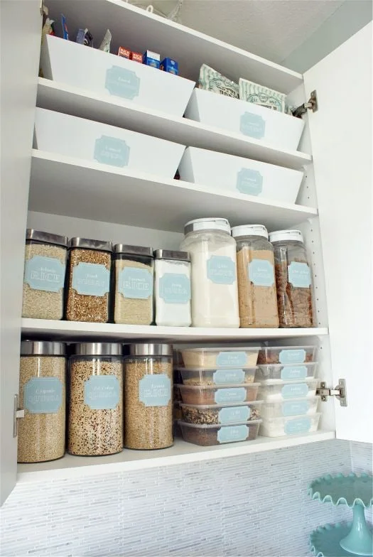 An organised pantry using dollar-store jars and homemade labels