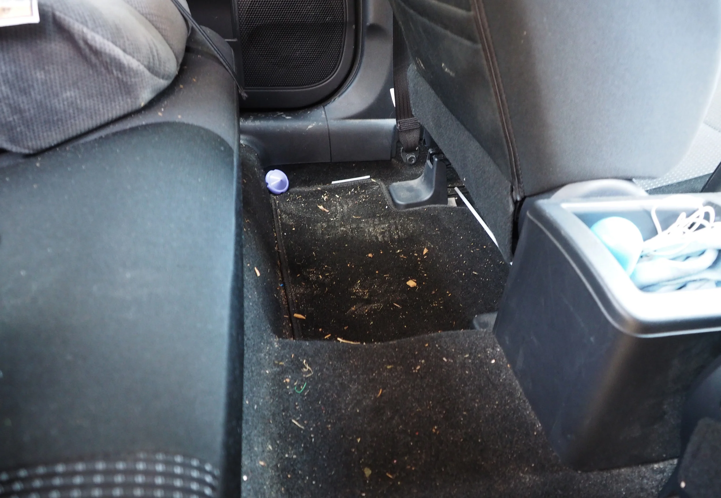 Messy car floor in desperate need of a declutter and clean!