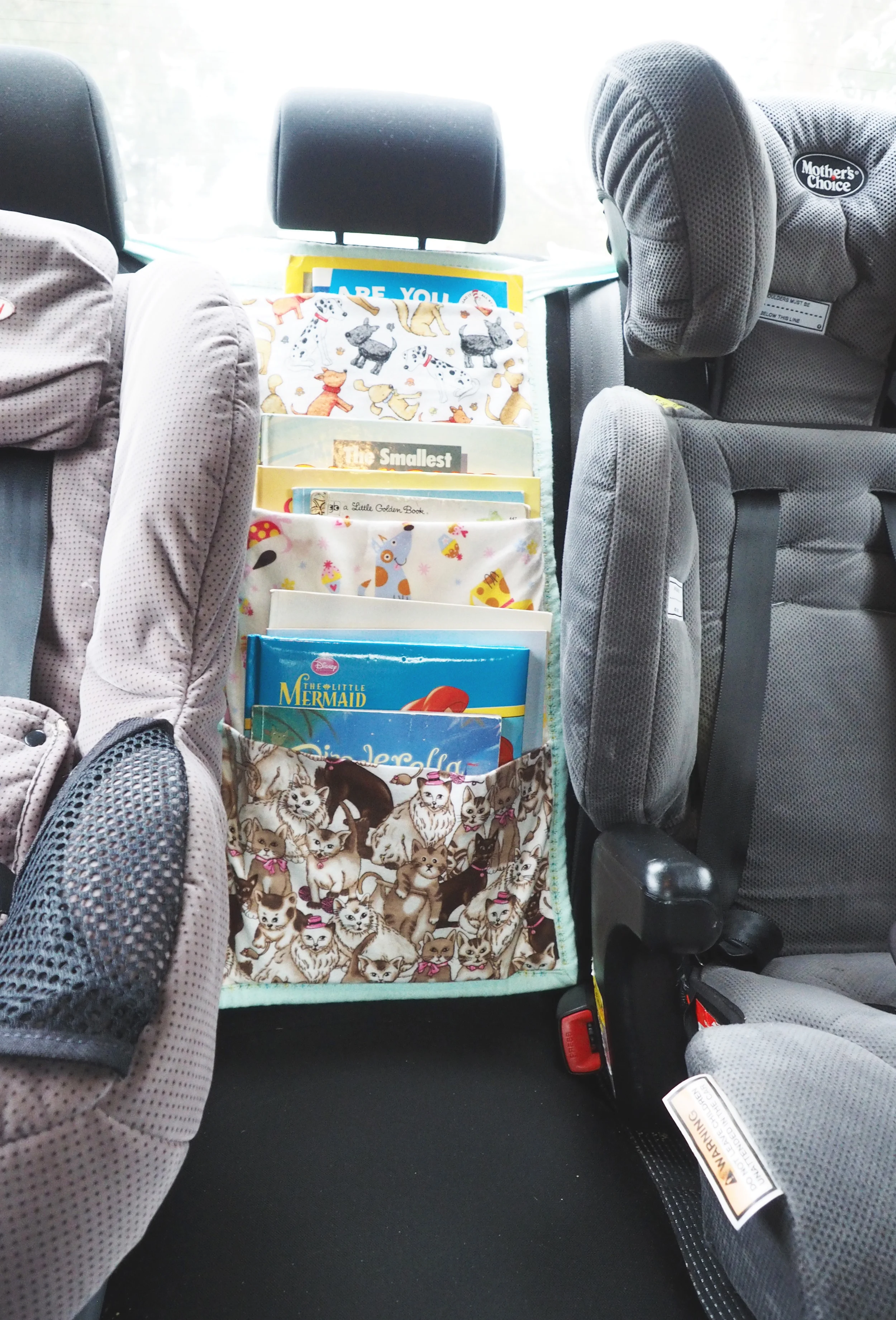 A car travel book bag to keep kids entertained in the car, and maximize storage space in the back-seat - The Organised You