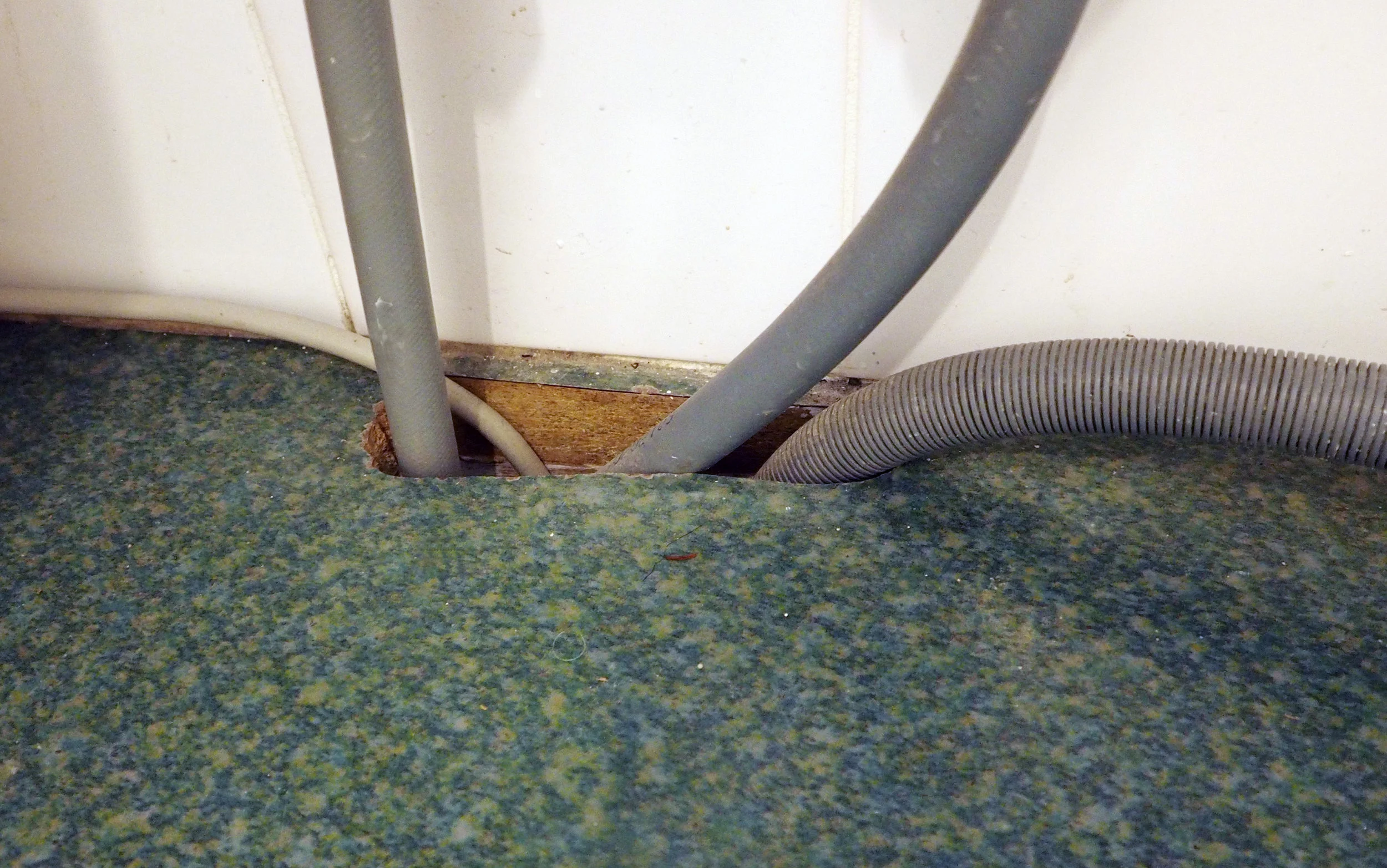 Cut a small hole in a bench or desk to feed cords through - The Organised You