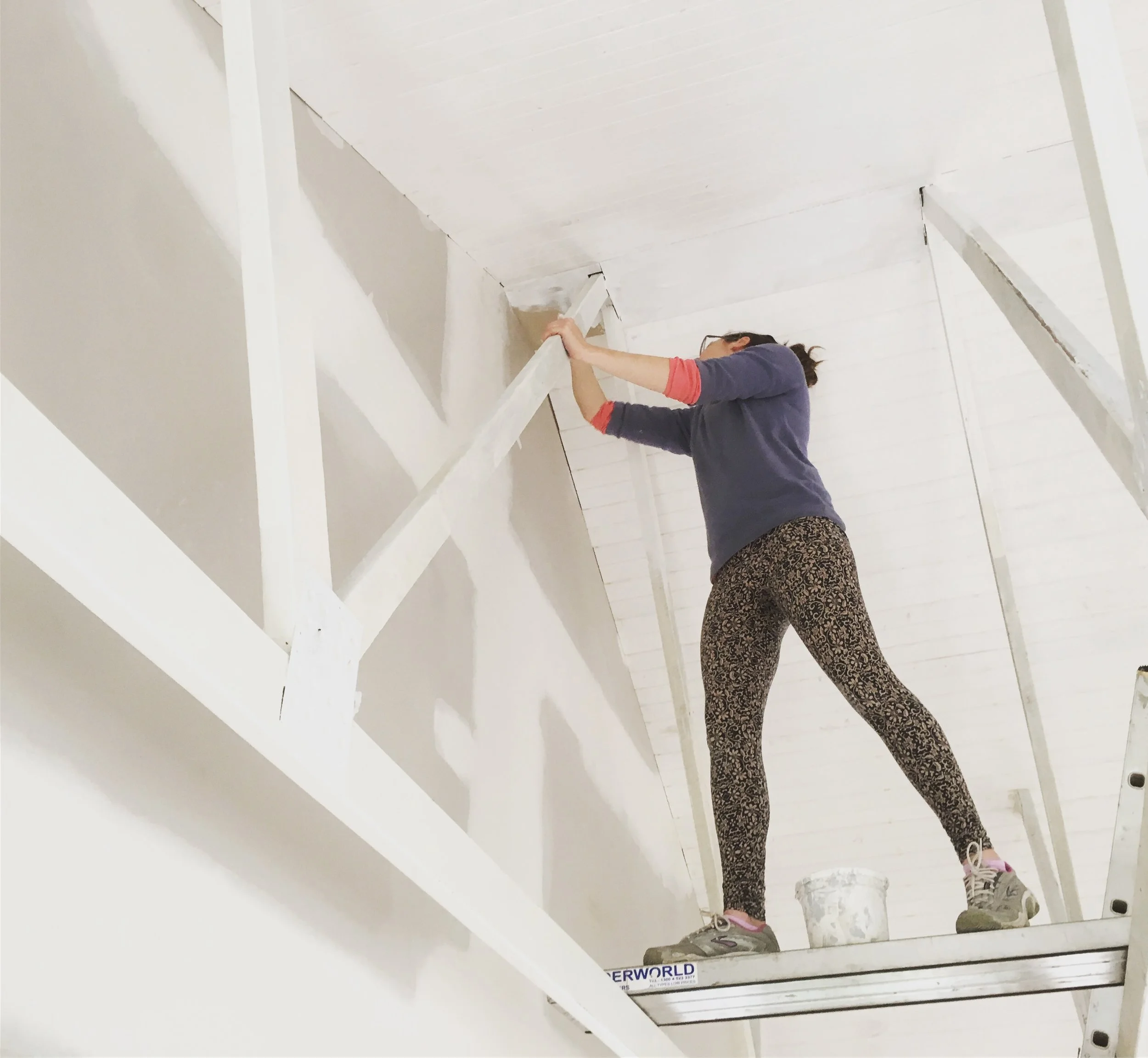 Painting exposed beams for a pitched ceiling