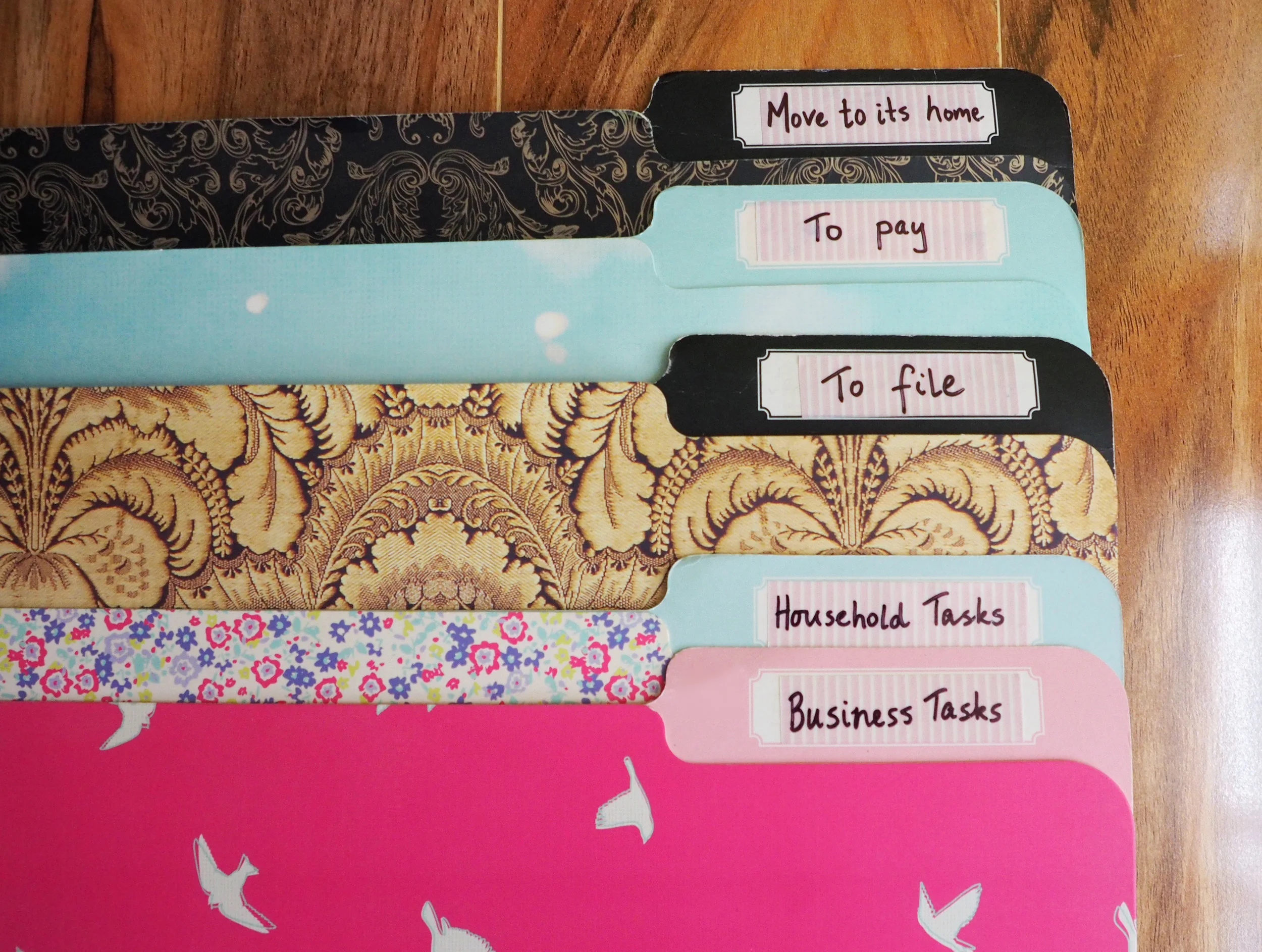 Use labelled file folders to organise paperwork and create an easy-to-deal-with paper sorting system