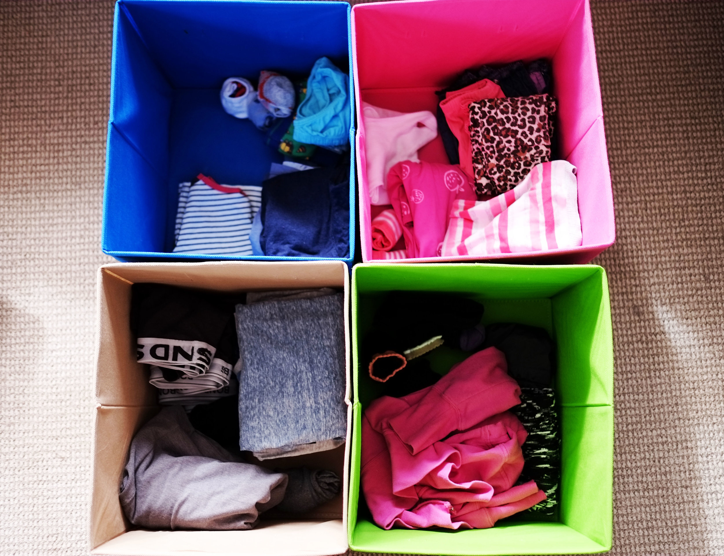 Use colour-coded baskets to sort and store clothes for each family member {The Organised You}