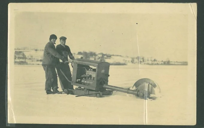 Employees of R.H. Locke's ice company cut the day's harvest. 
