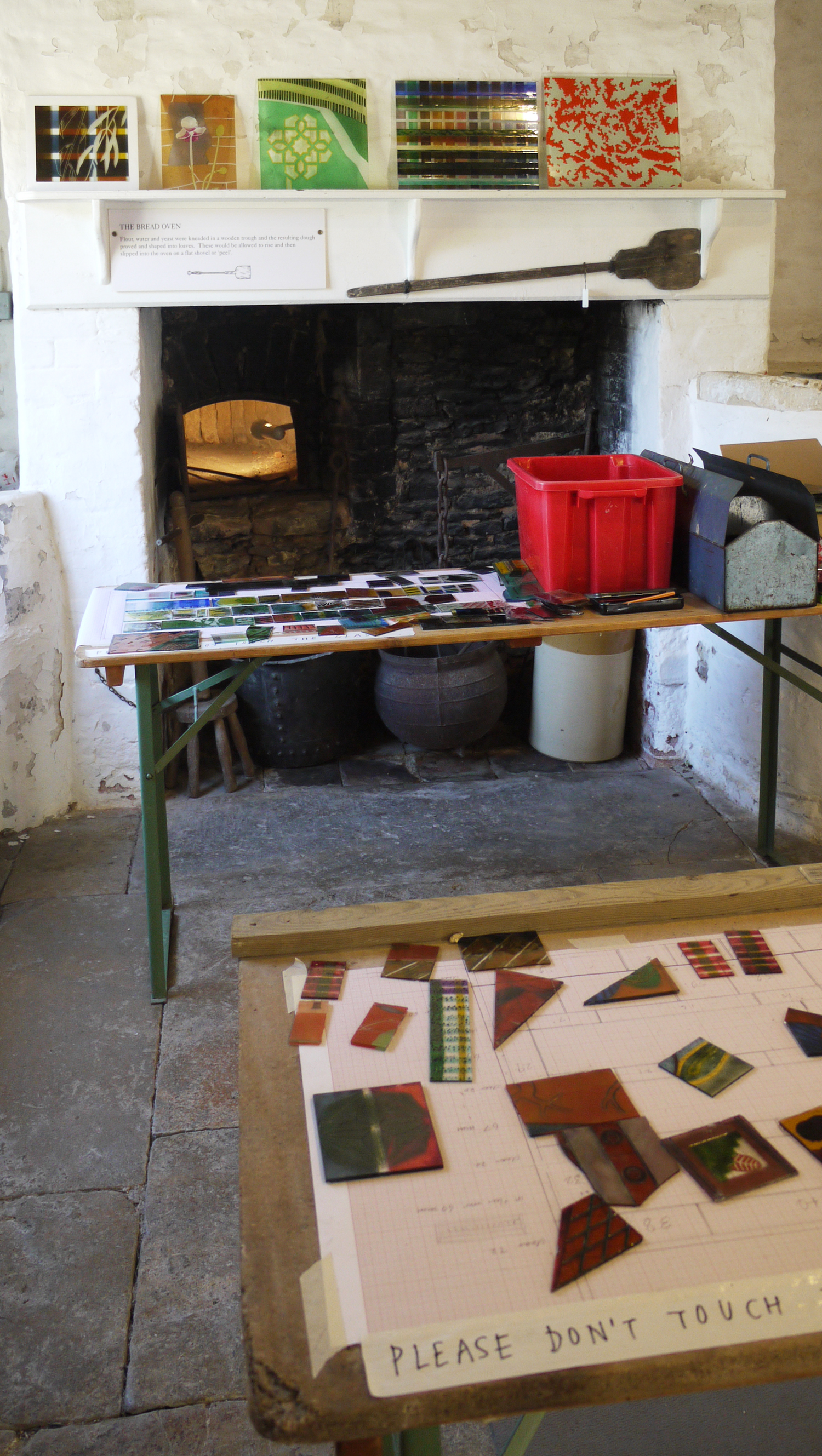 Samples of enamelled glass on the mantlepiece and in pieces on the tables on top of my plan for a stained glass window. 'Always think your design out in your head before you begin to get it on the paper. Don’t begin by slobbering and messing about in the hope that something may come out of it. You must see it before you can draw it, whether the design be of your own invention or nature’s.’ William Morris ‘Art and the Beauty of the Earth’ (lecture 1881)