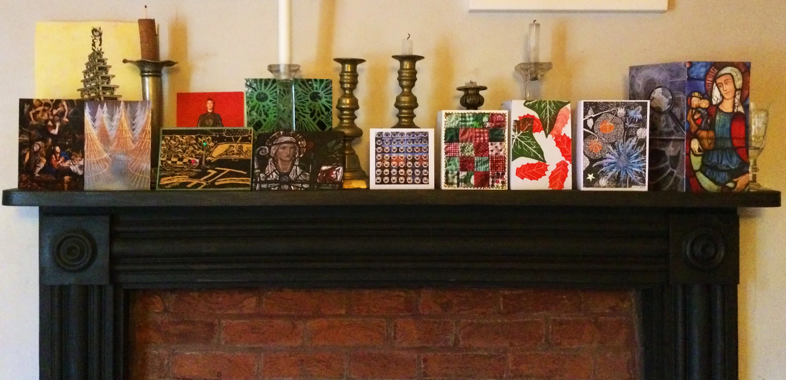 My favourite cards on the mantlepiece, particularly the patterned ones in the middle with seasonal colours and glitter! Click to enlarge.