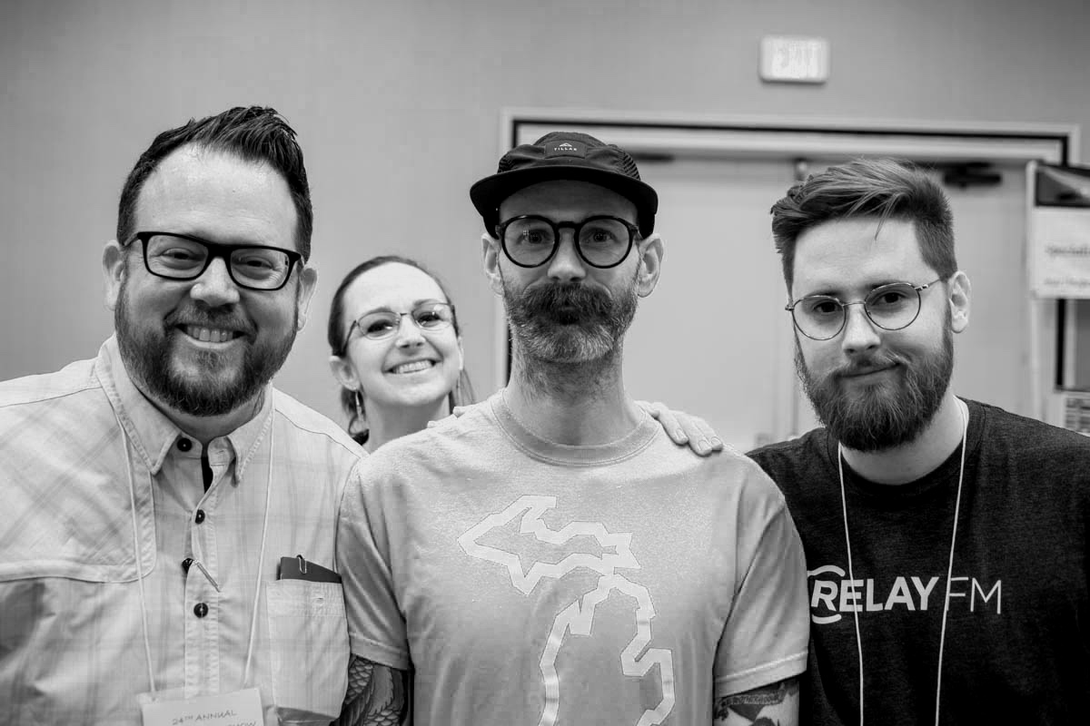 You know ‘em! From left to right we’ve got Brad, Jeff, Myke and, creeping in the back, Jessie.