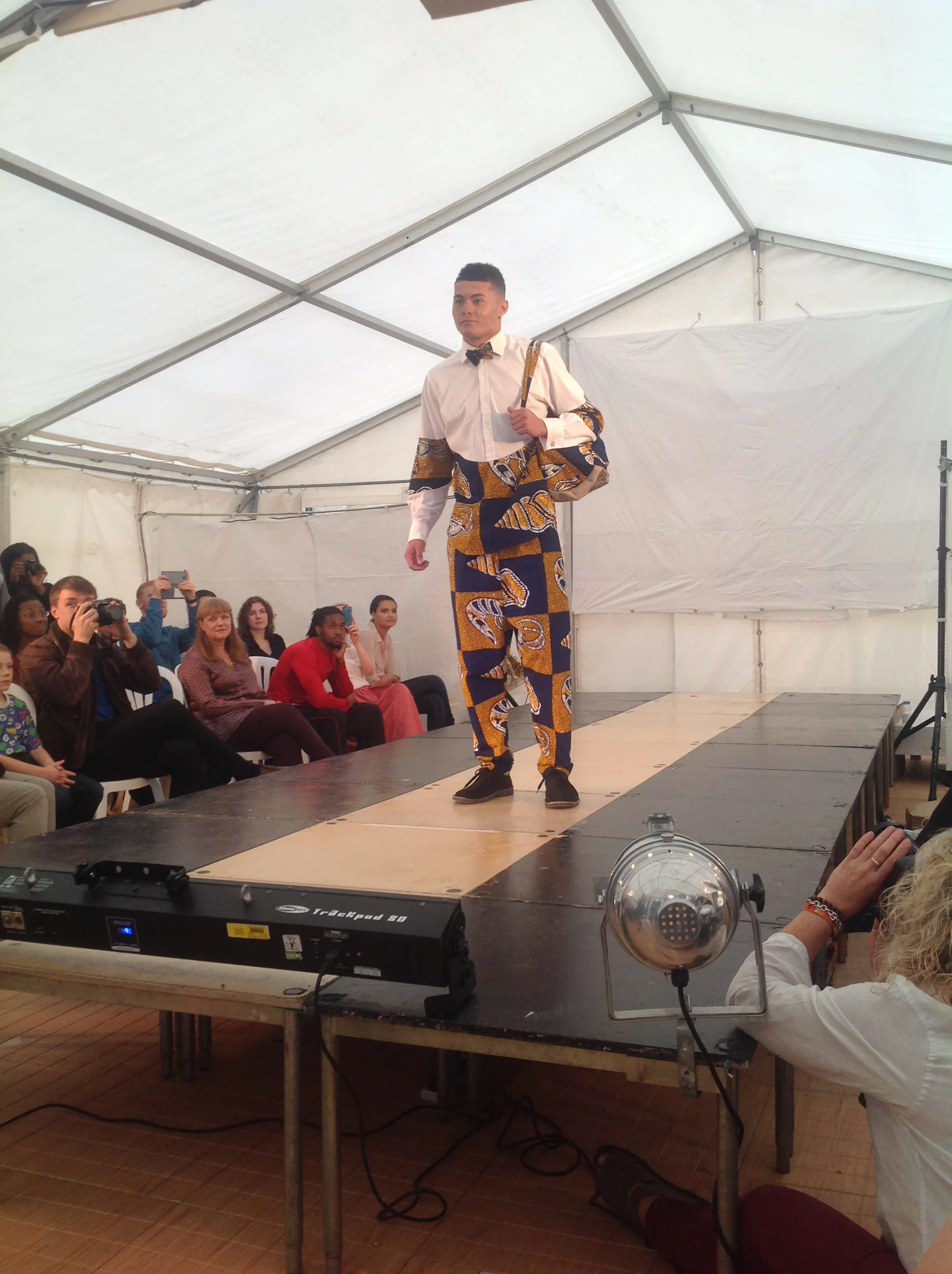 Jordon looking fierce in an upcycled shirt with matching drop-crotch trousers, bow-tie and upcycled hessian Duffle bag.