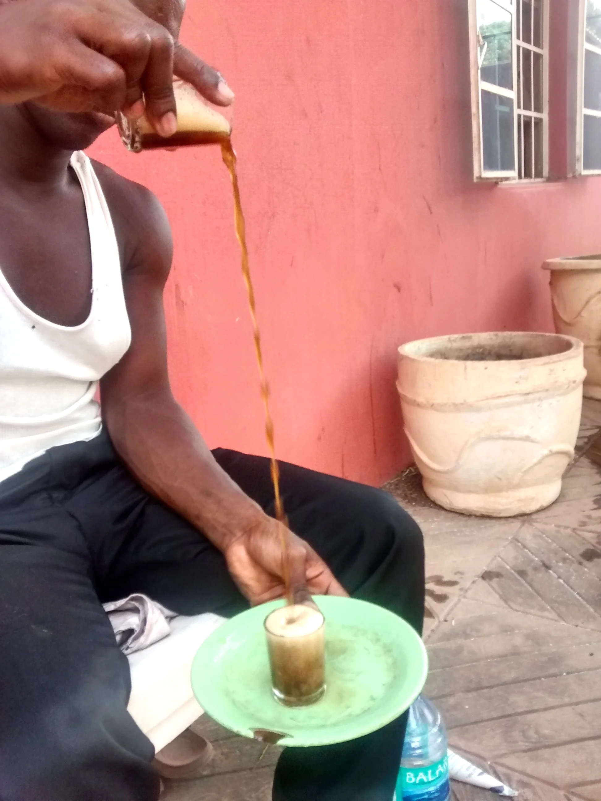 Strong hot green tea with lots of sugar is drunk in small glasses. Here my guide, Mbaye, creates the characteristic froth for the 1st cass. Its an art.