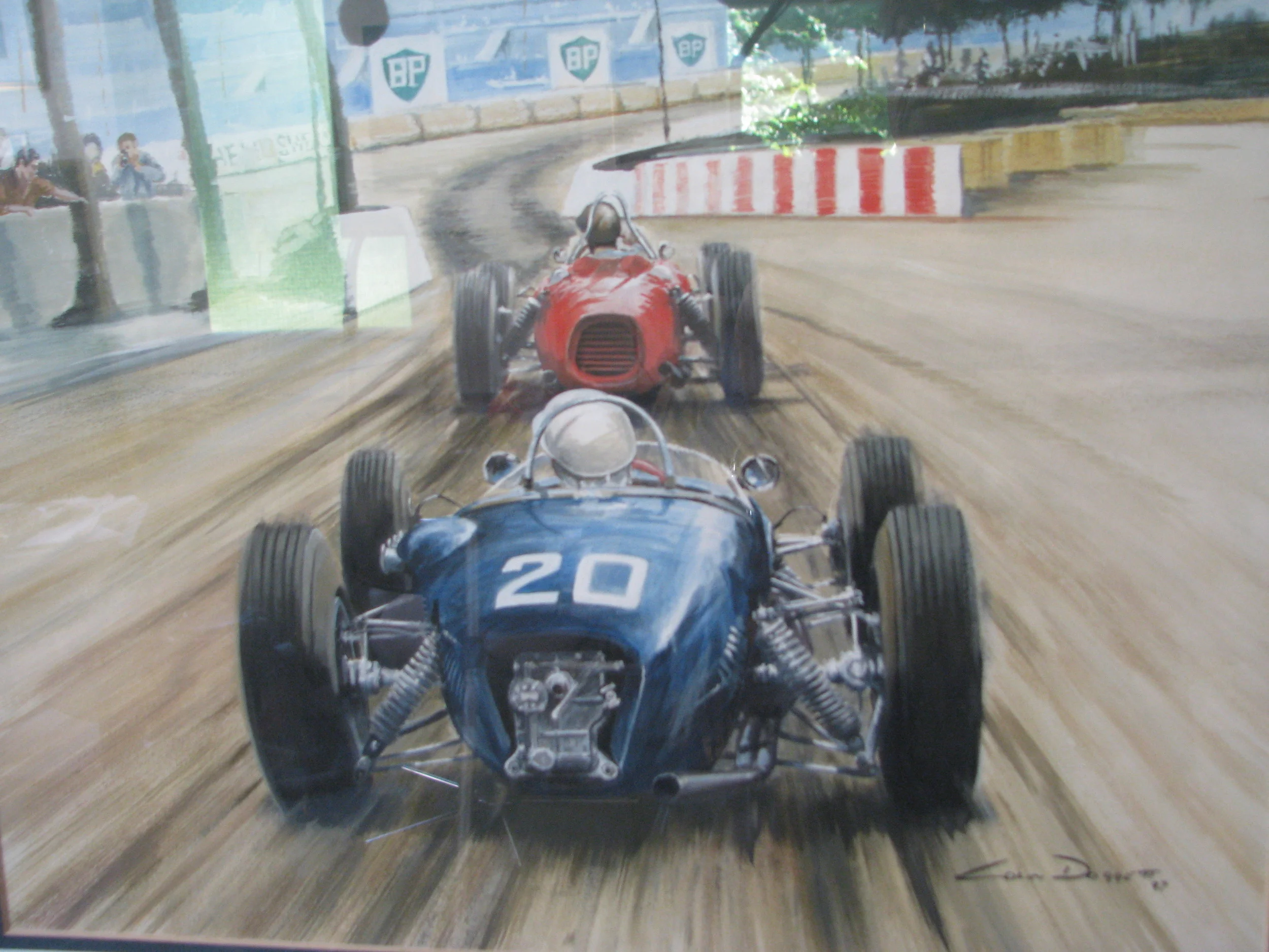 Sterling Moss, Lotus 18 follows Ritchie Ginthers Ferrari onto the harbour front while winning the 1961 Monaco GP. His greatest race. 14”x11” Prints of original available. 