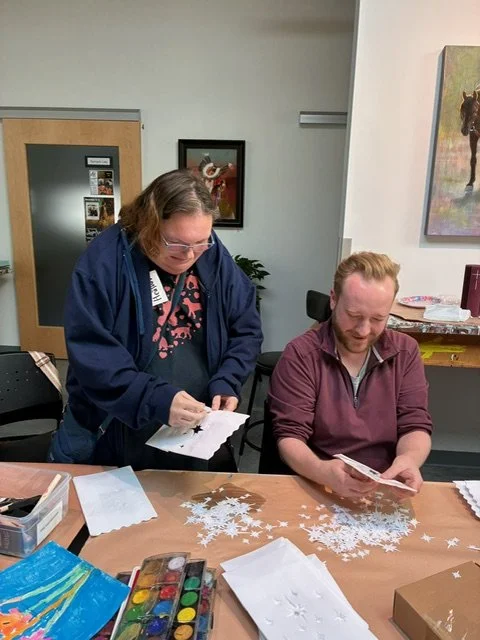 Volunteers with Art For All prepare the luminaria