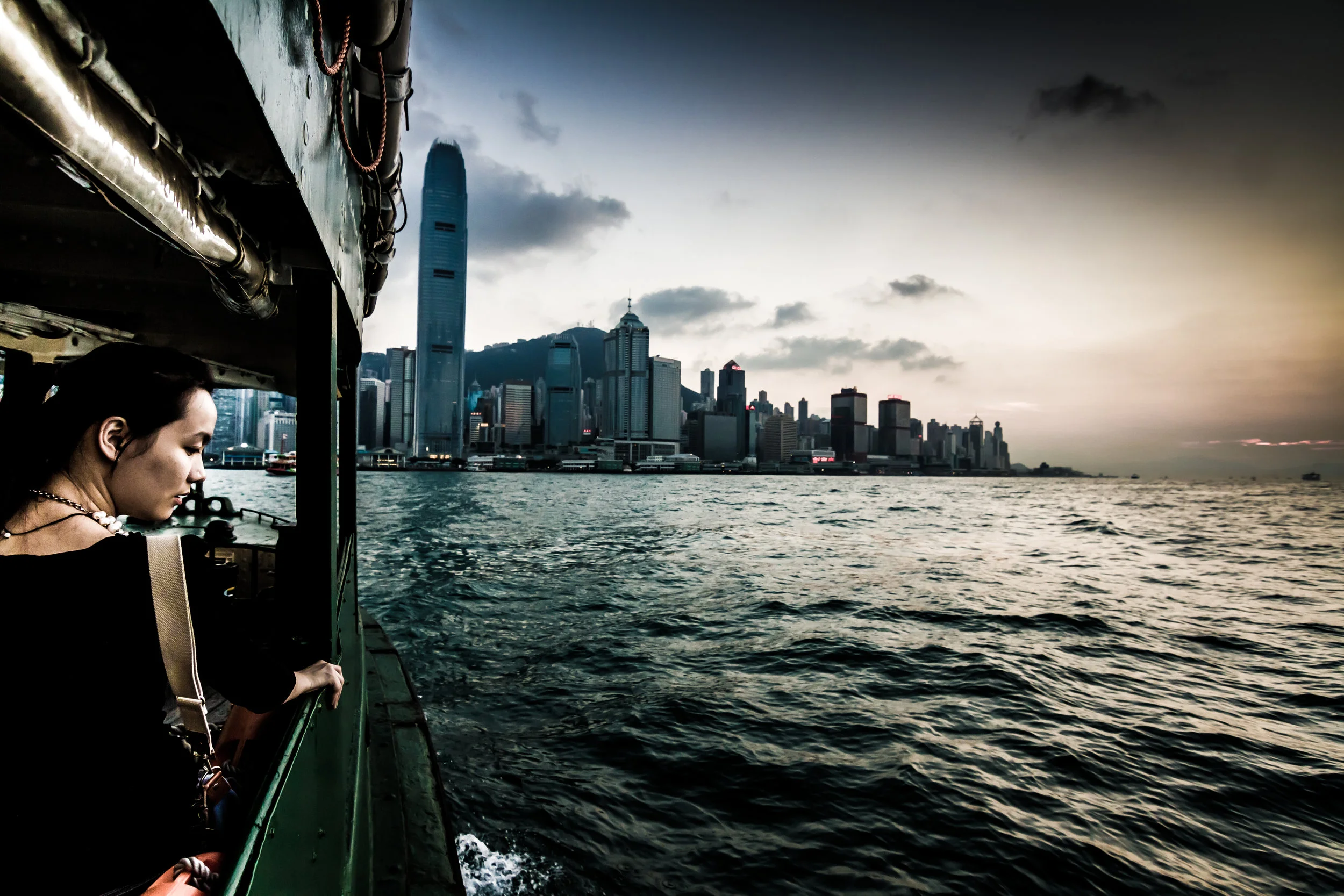 HK-StarFerryWomanSkyline-7D-9-6-14.jpg