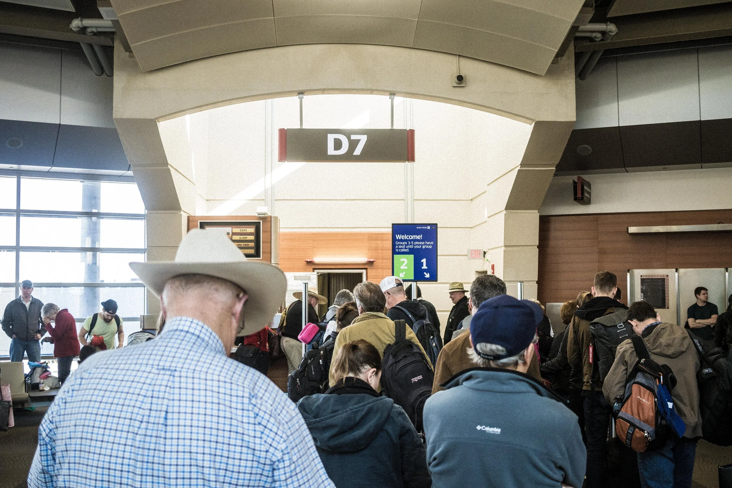 Nola-MSYAirport-BoardingGateManinCowboyHat.jpg