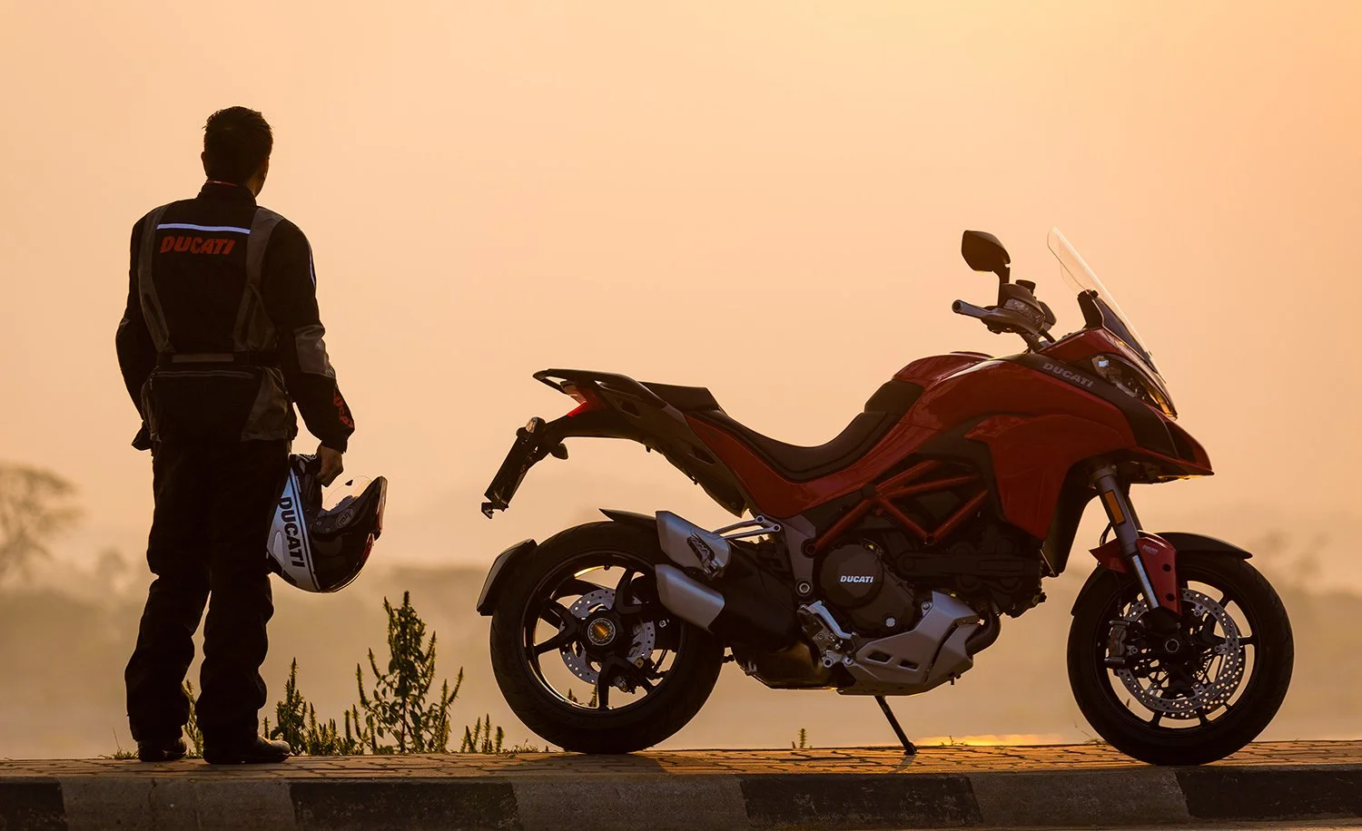  Ducati motorbike at sunset in Thailand 