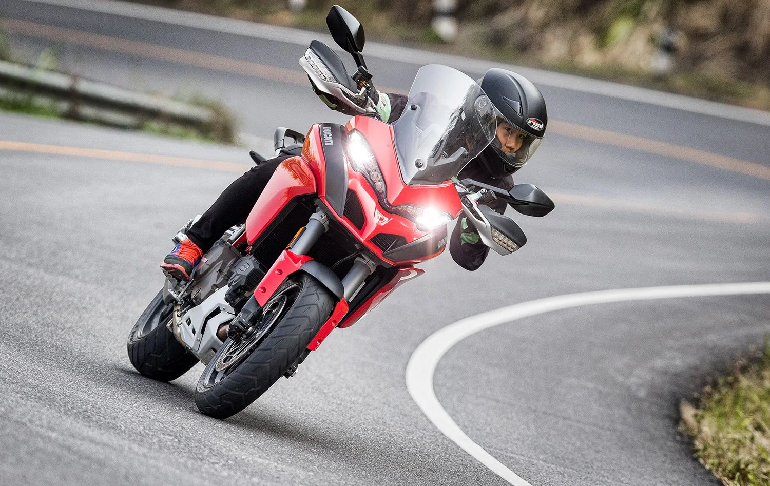  Ducati motorbike taking a corner at speed 
